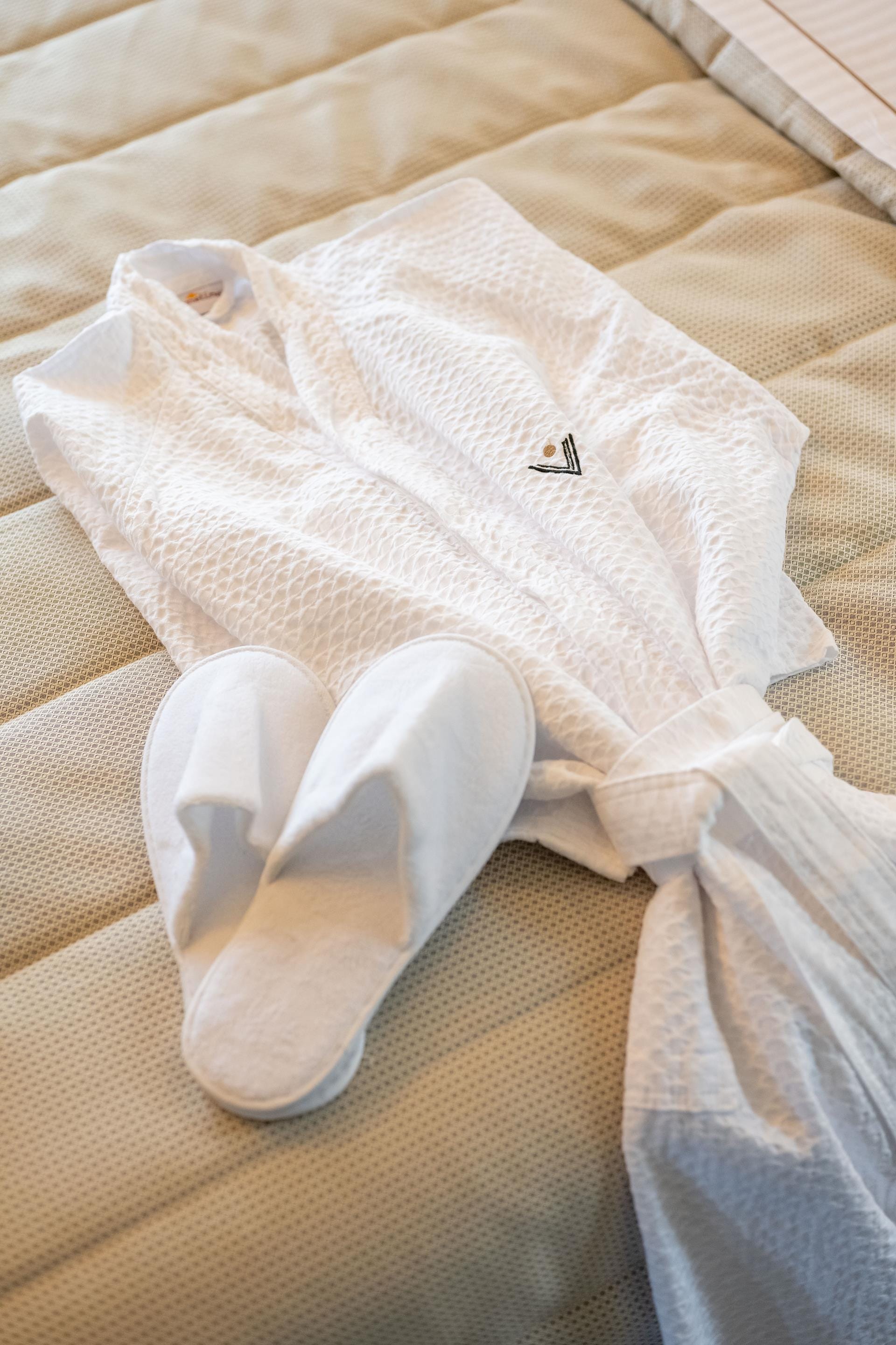 a white sock on a bed