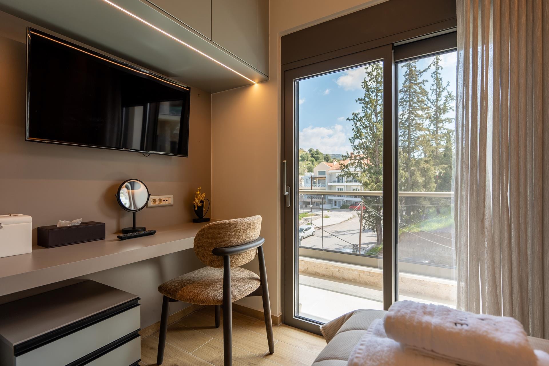 a room with a desk and a tv