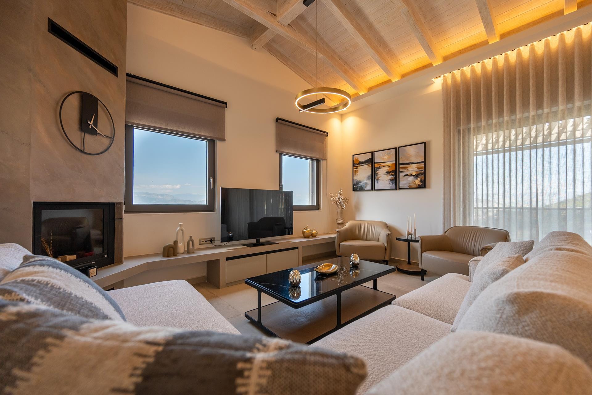 a living room with a tv and couches