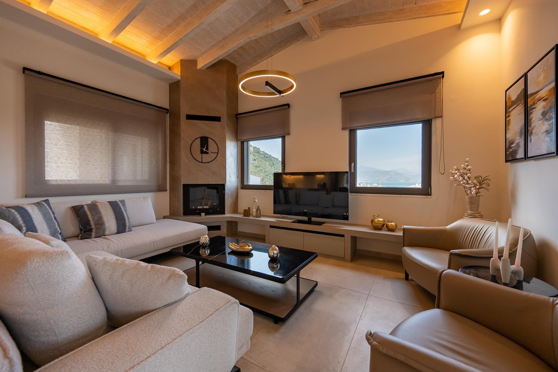 a living room with a tv and couches