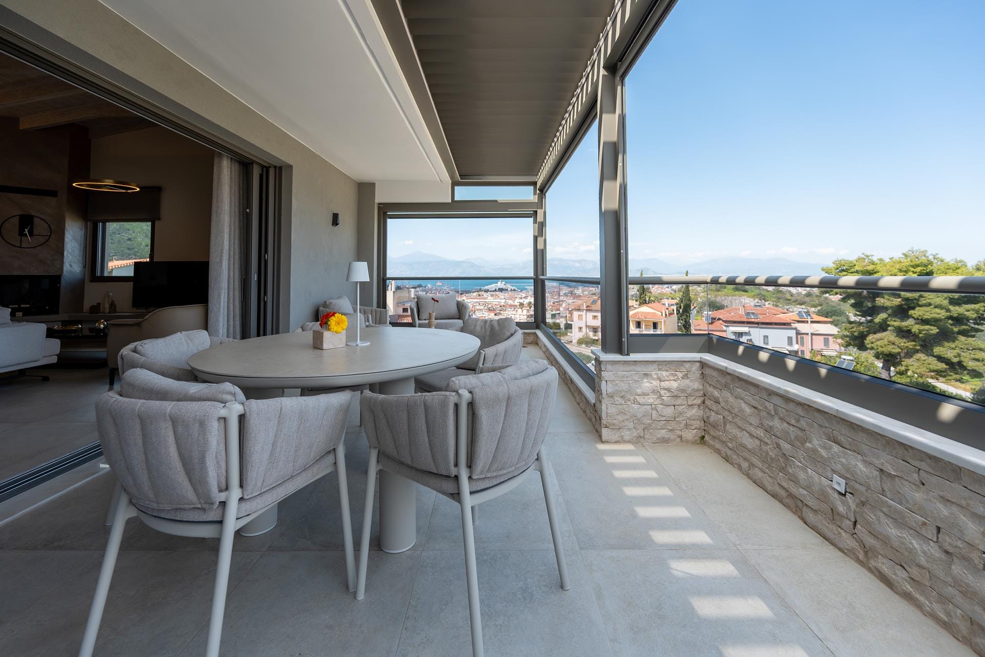 a table and chairs on a balcony