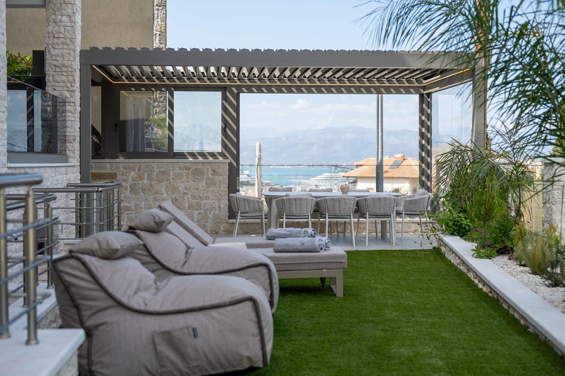 a patio with a deck and chairs