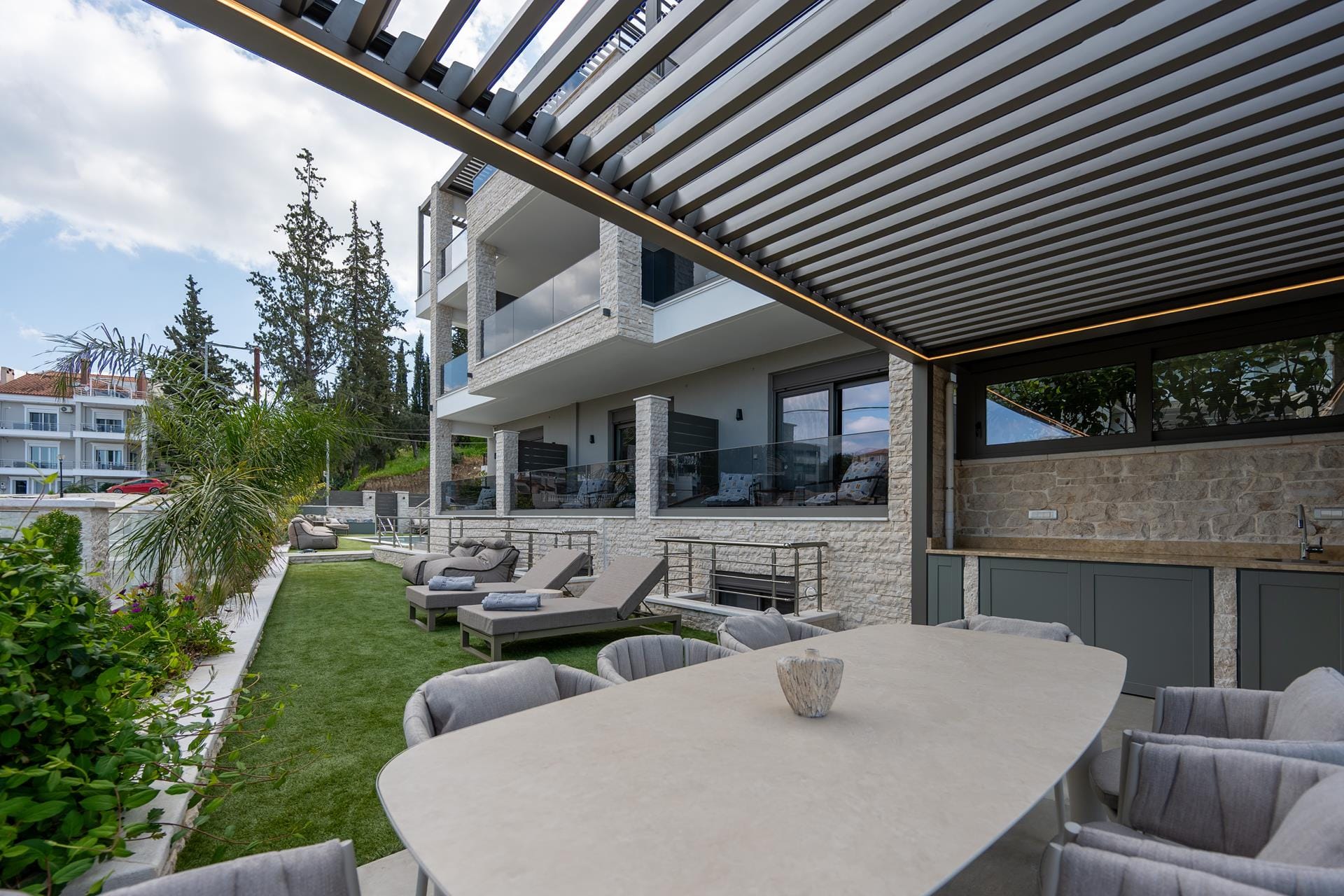 a house with a patio and a table and chairs