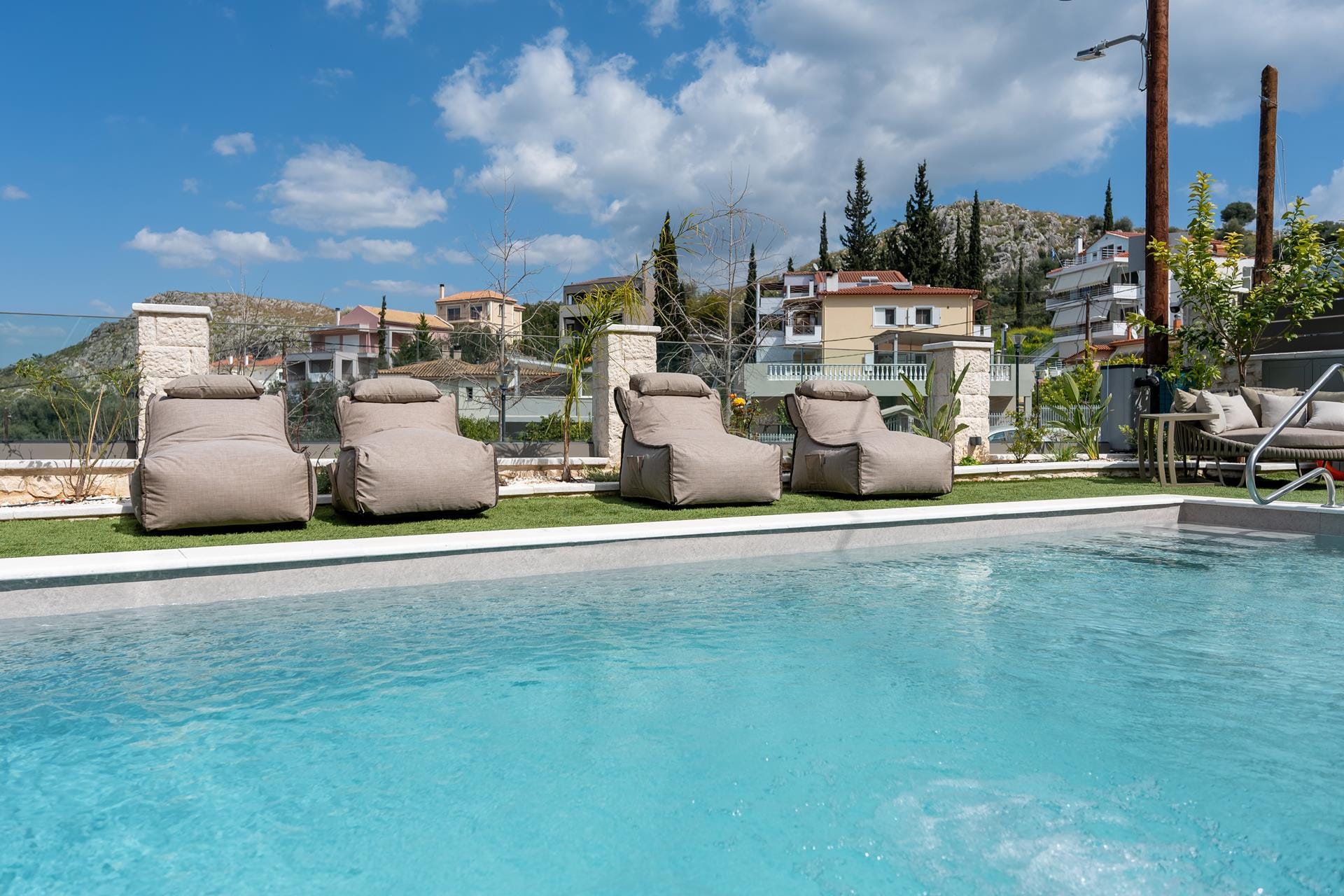 a pool with chairs around it
