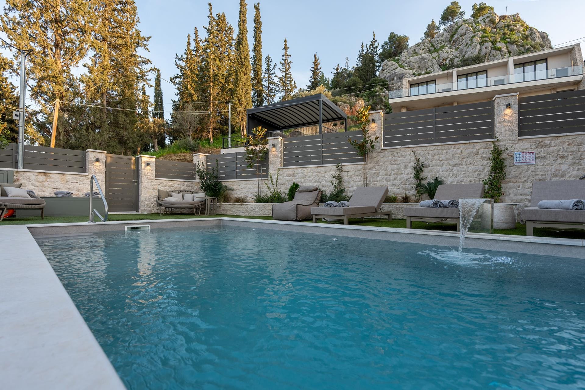 a swimming pool with a building in the background