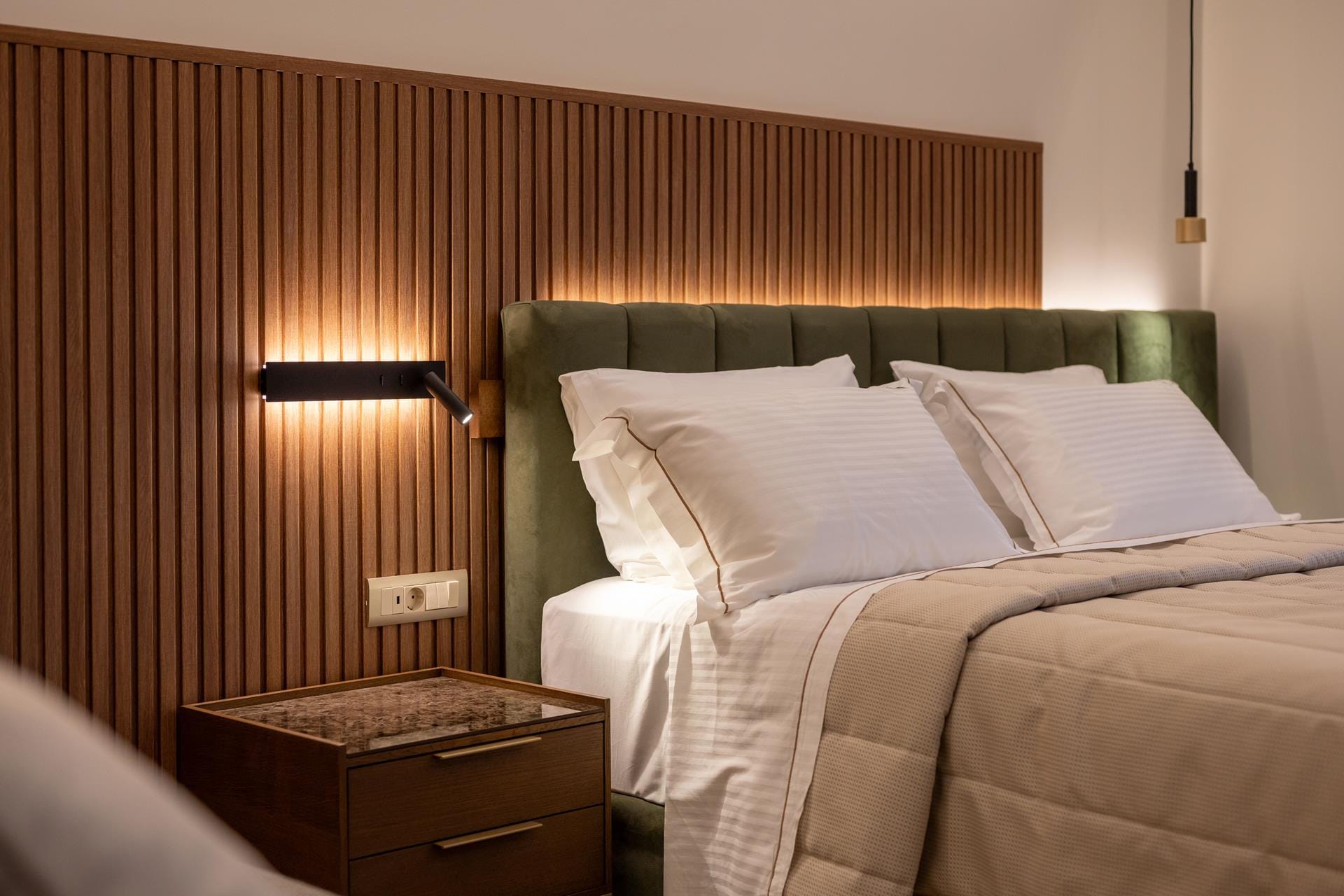 a bed with a white bed spread