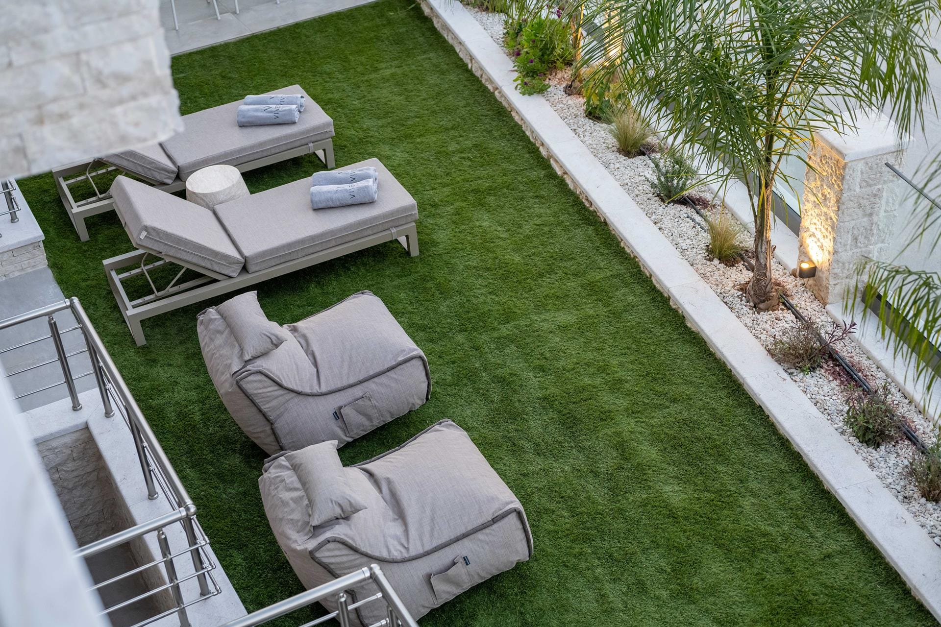 a backyard with a patio and a table and chairs