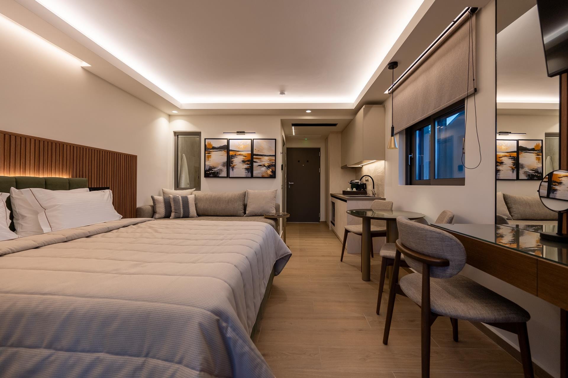 a hotel room with a bed and desk