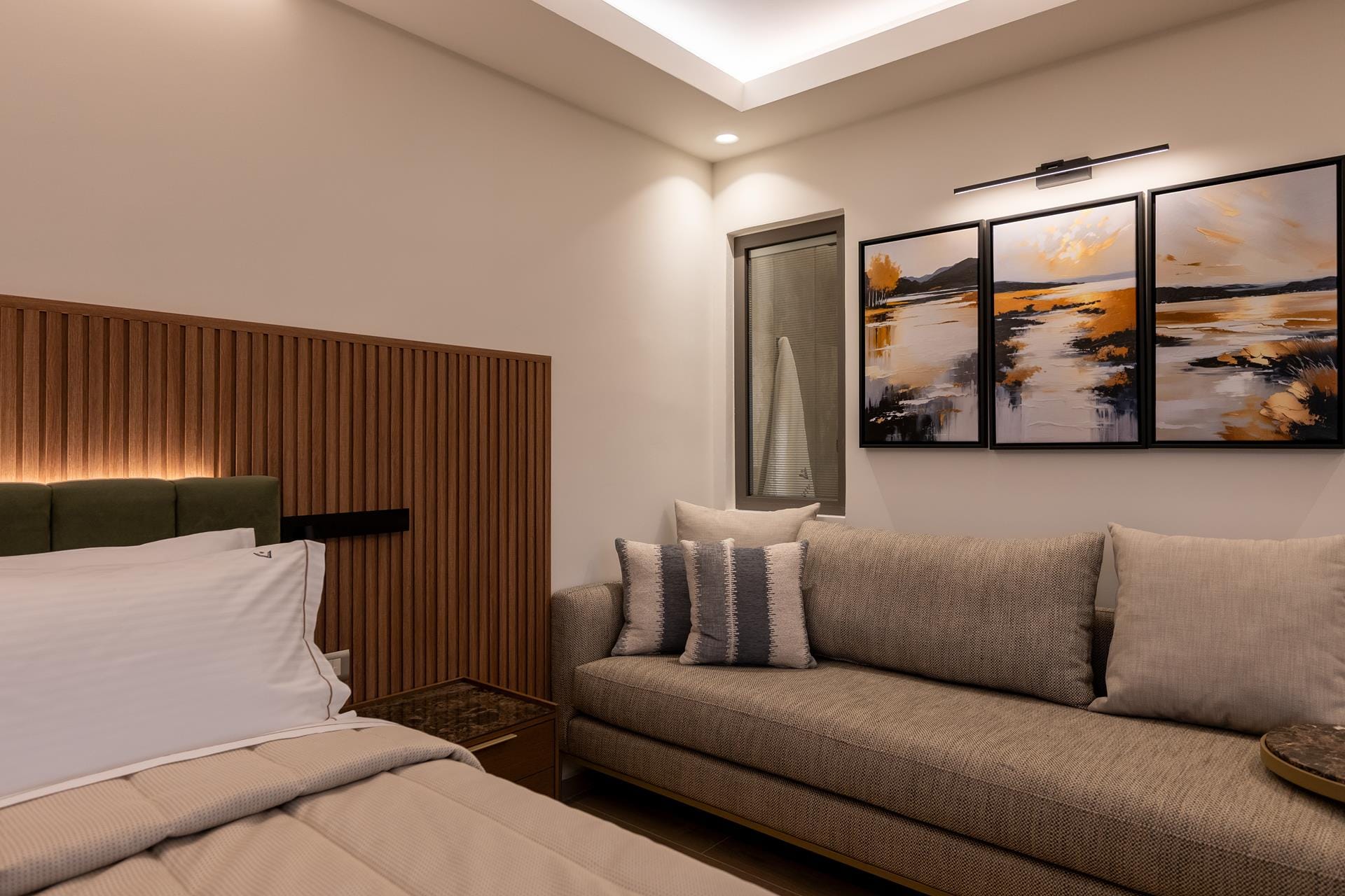 a hotel room with a bed and a couch