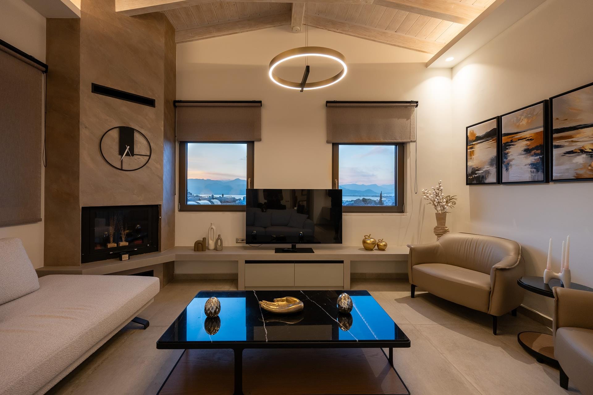 a living room with a tv and couches