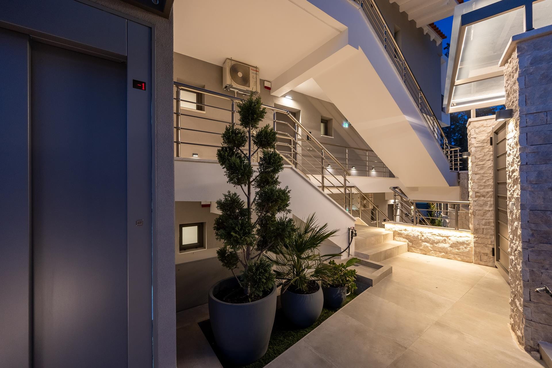 a courtyard with potted plants