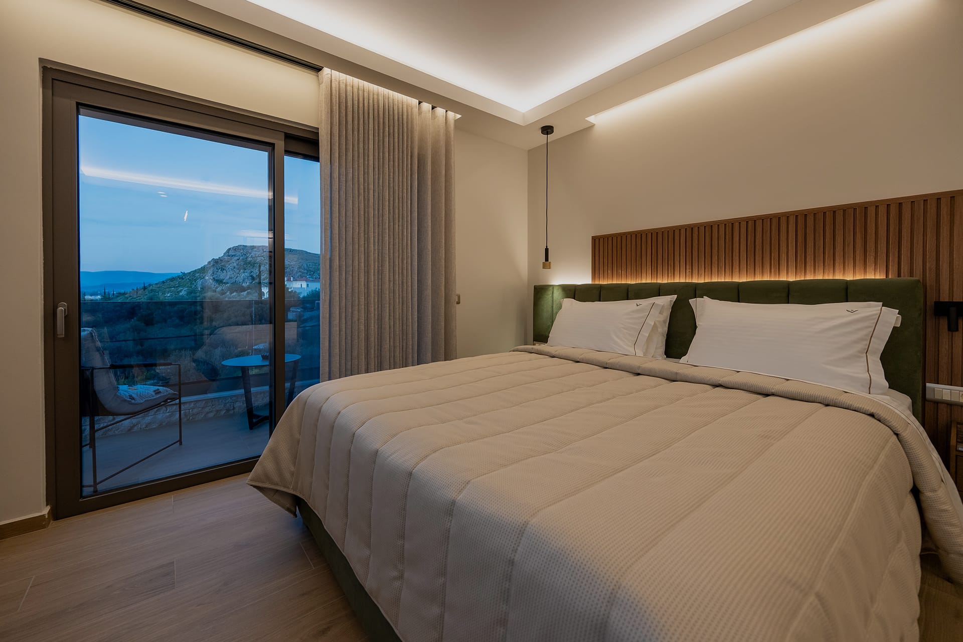 a bedroom with a large window