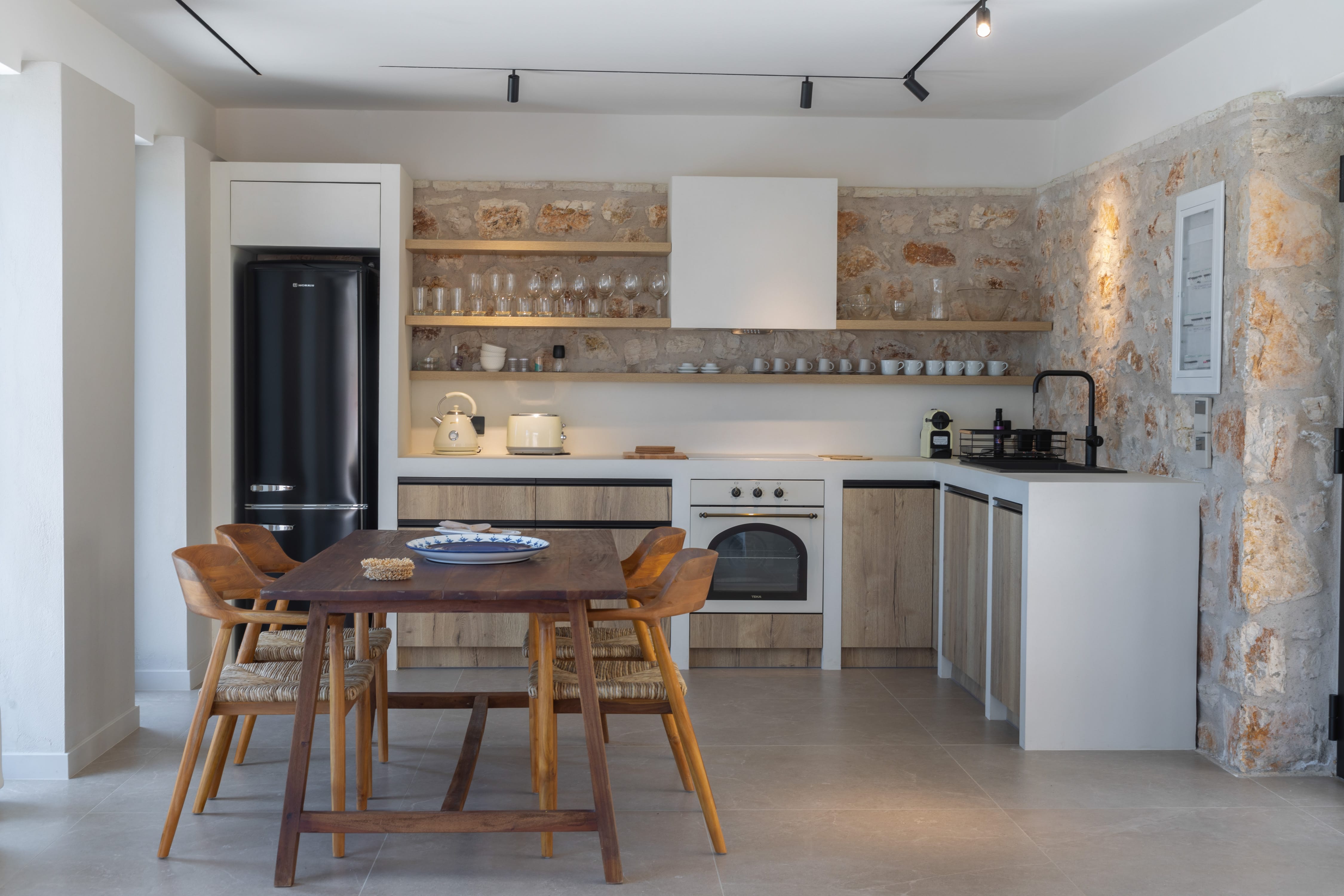 a kitchen with a dining table