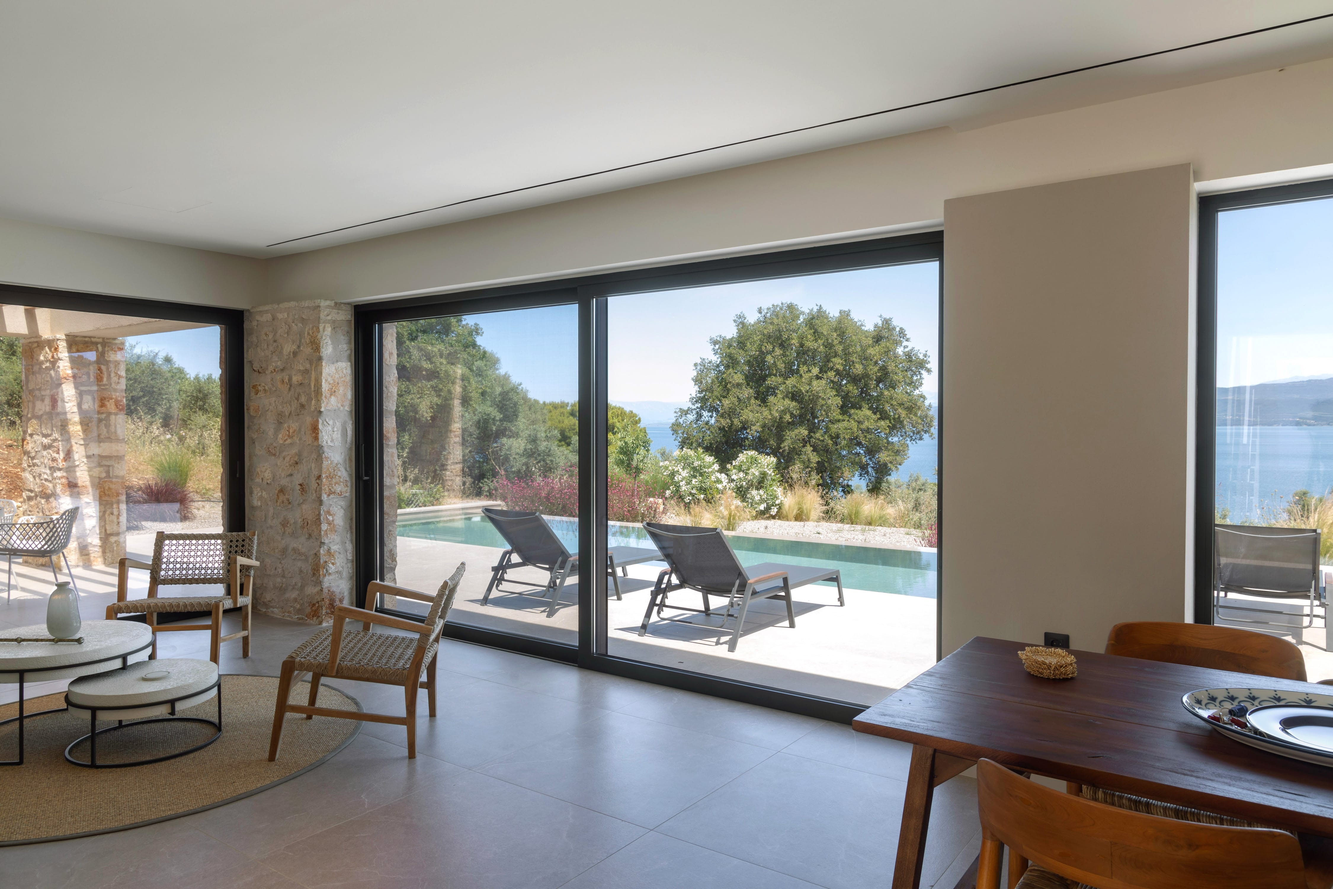 a room with a large window and chairs