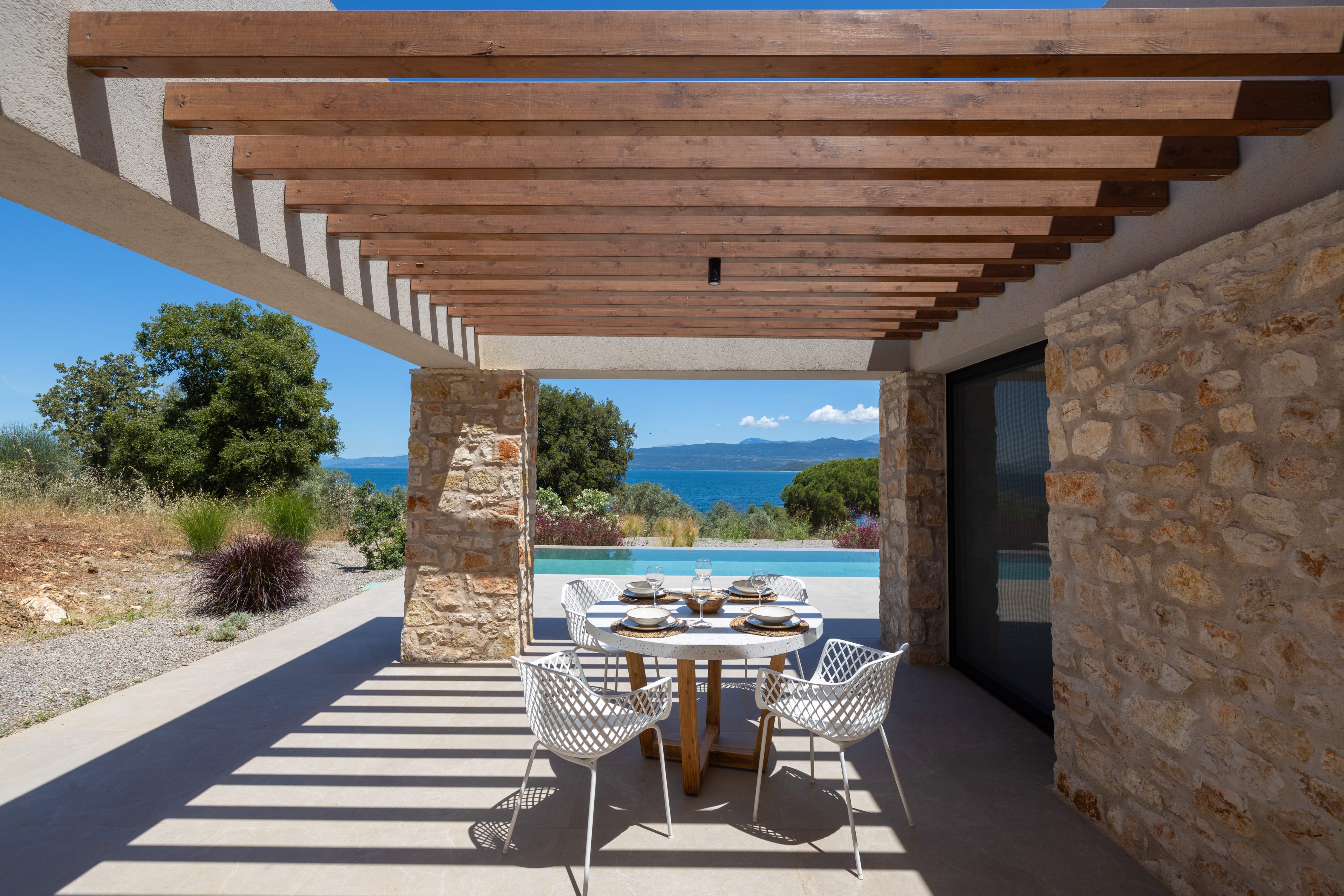 a patio with a table and chairs