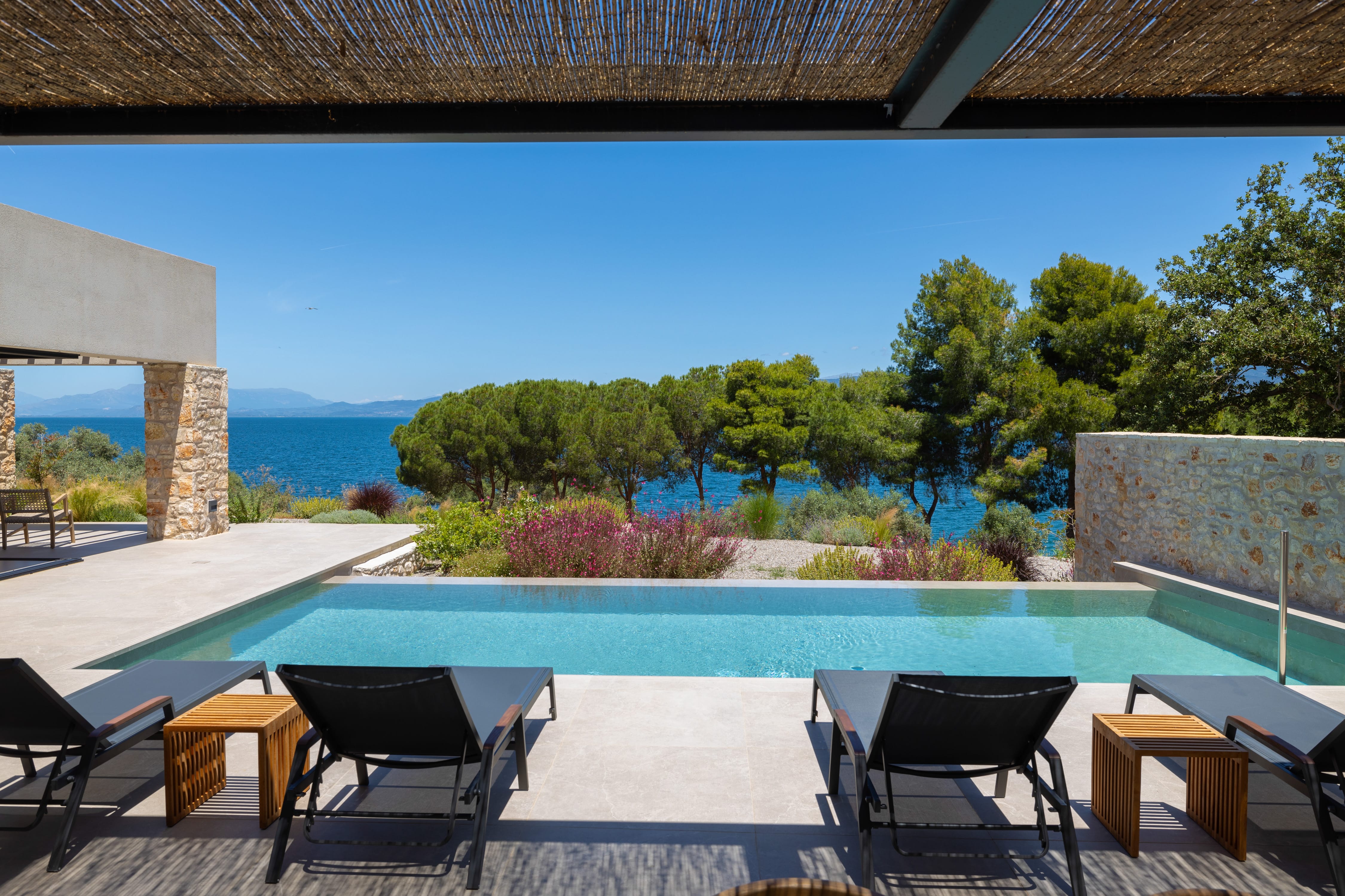 a pool with chairs around it