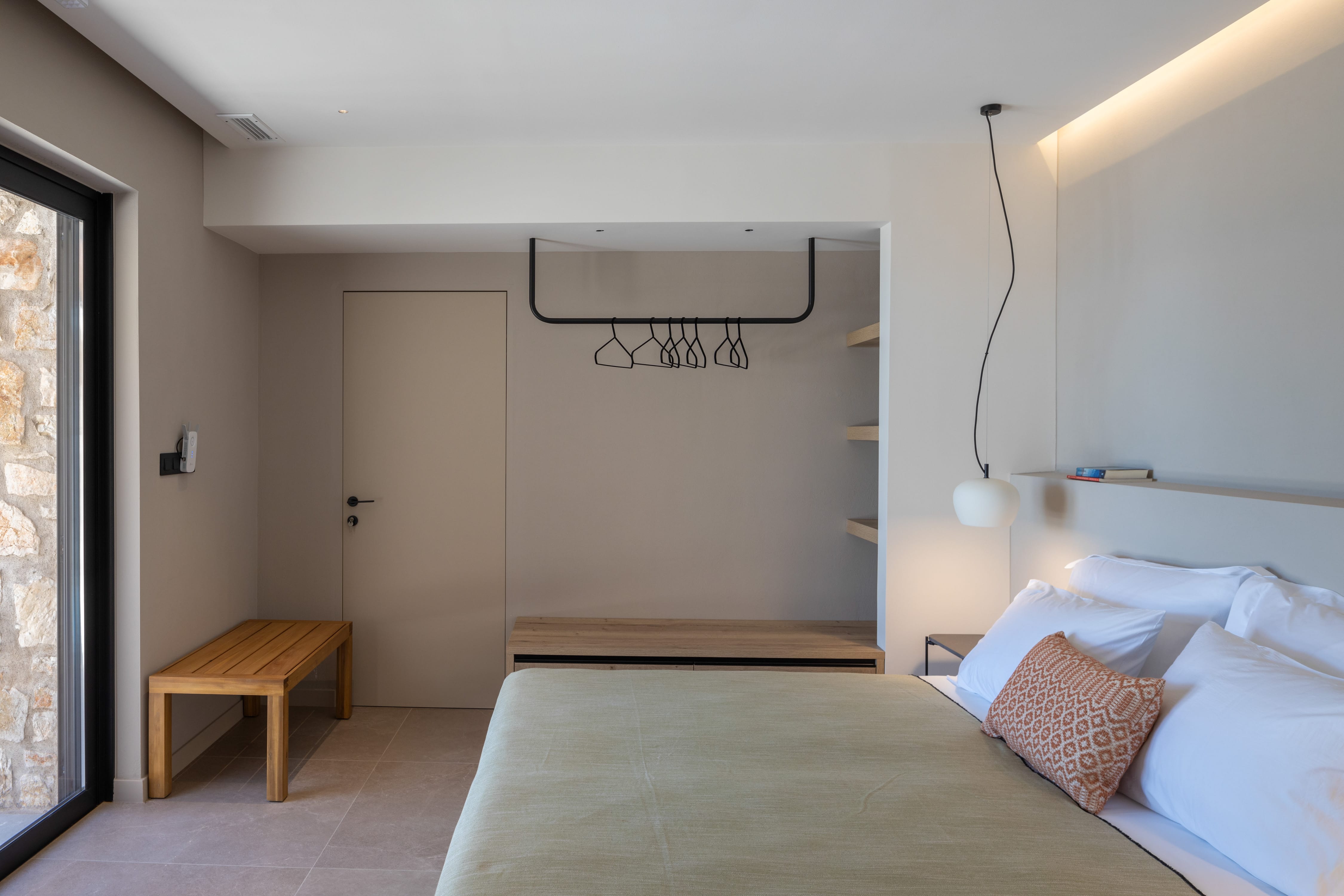 a bedroom with a bed and a table