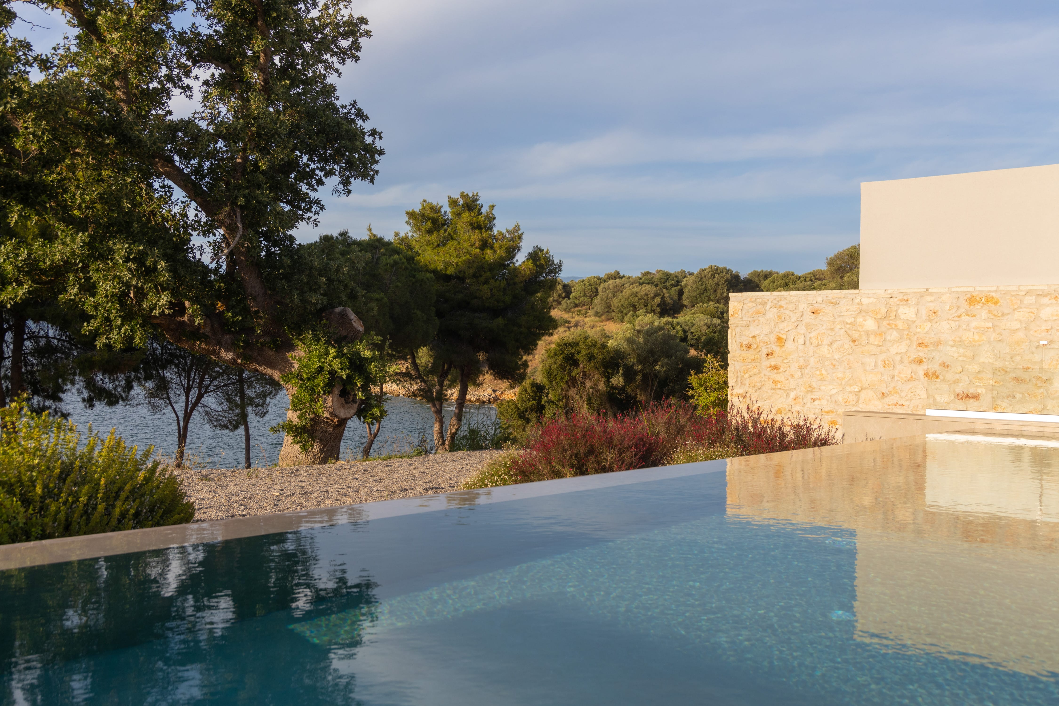 a pool with trees and a building