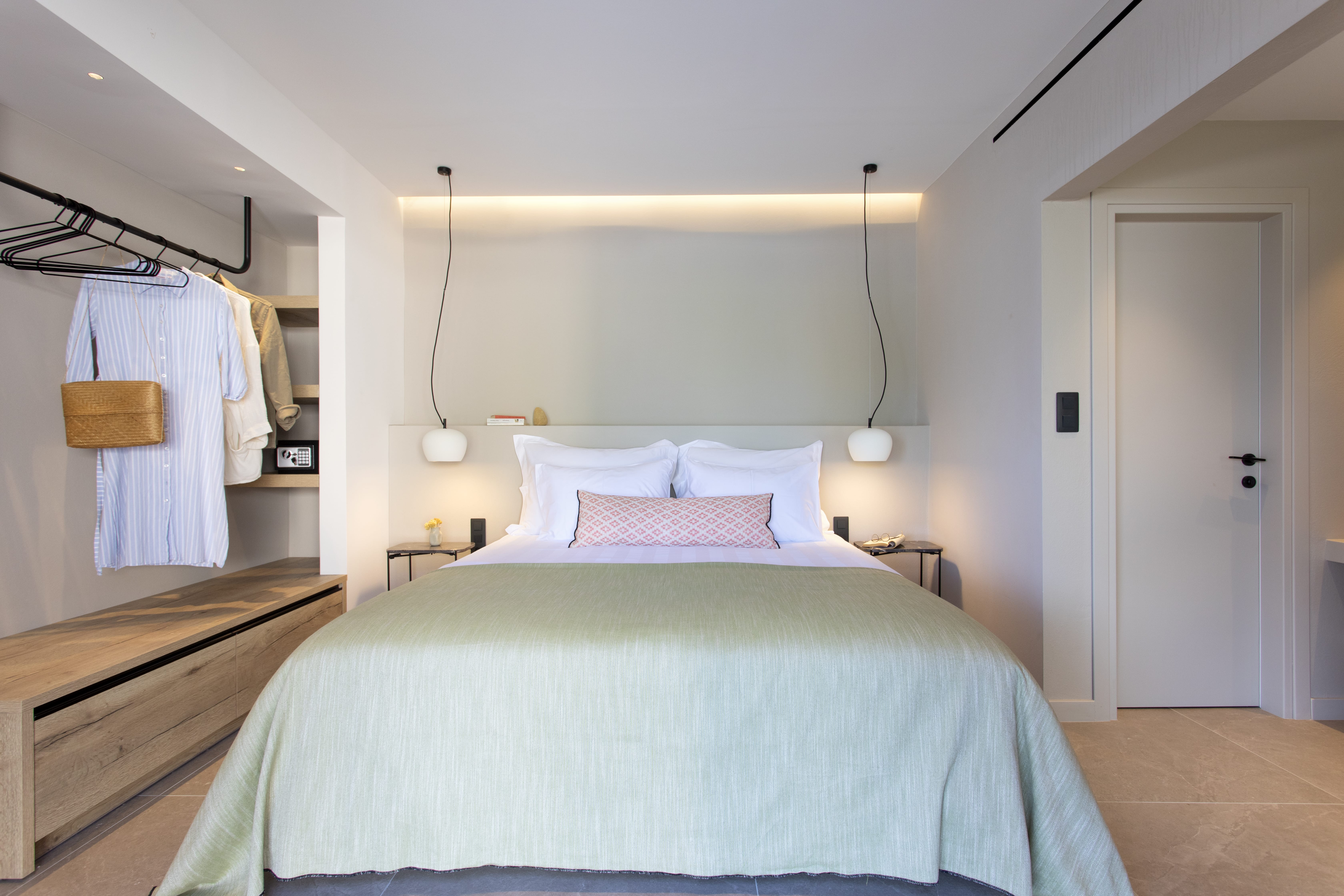 a bed with a white bed spread