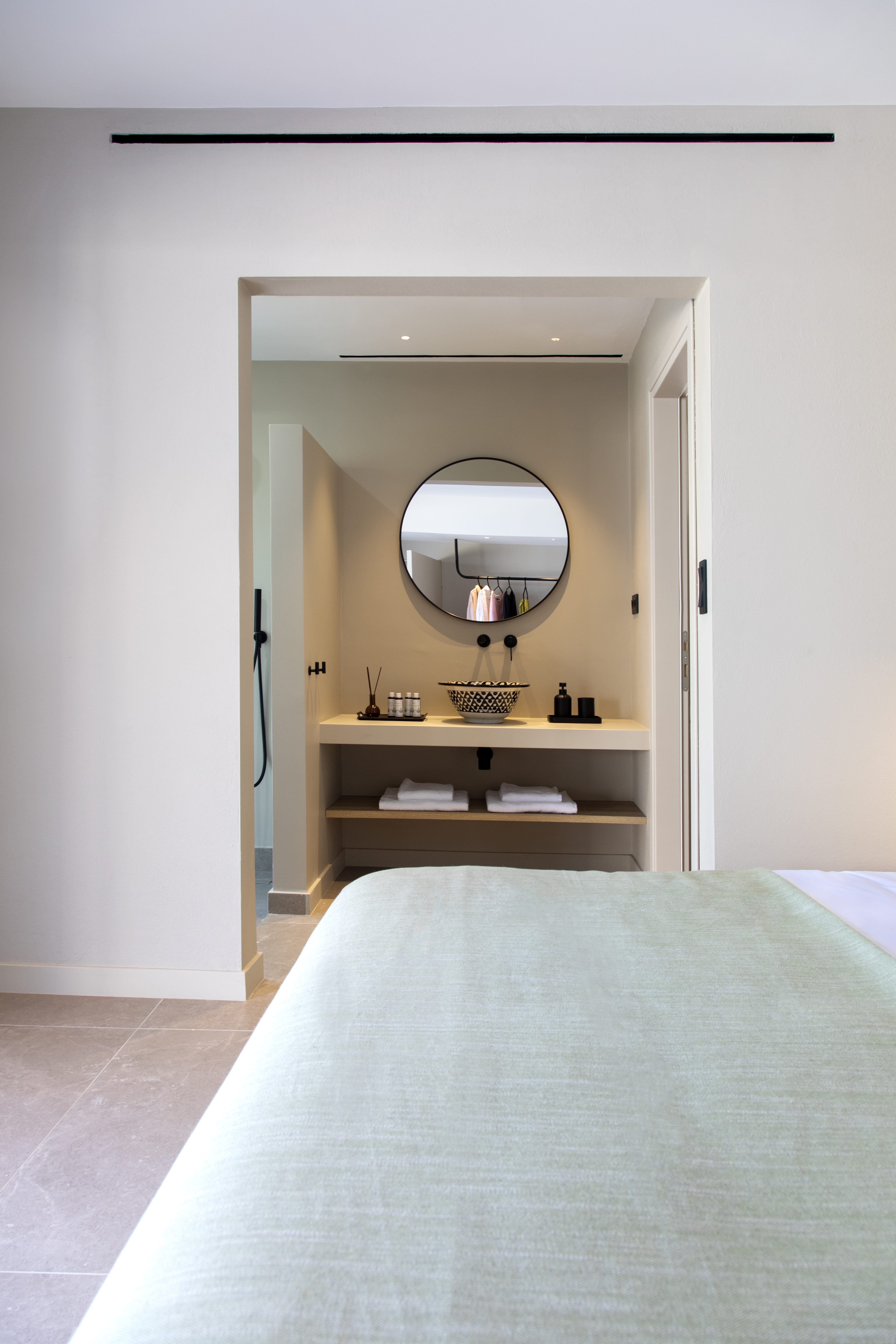 a mirror above a bed