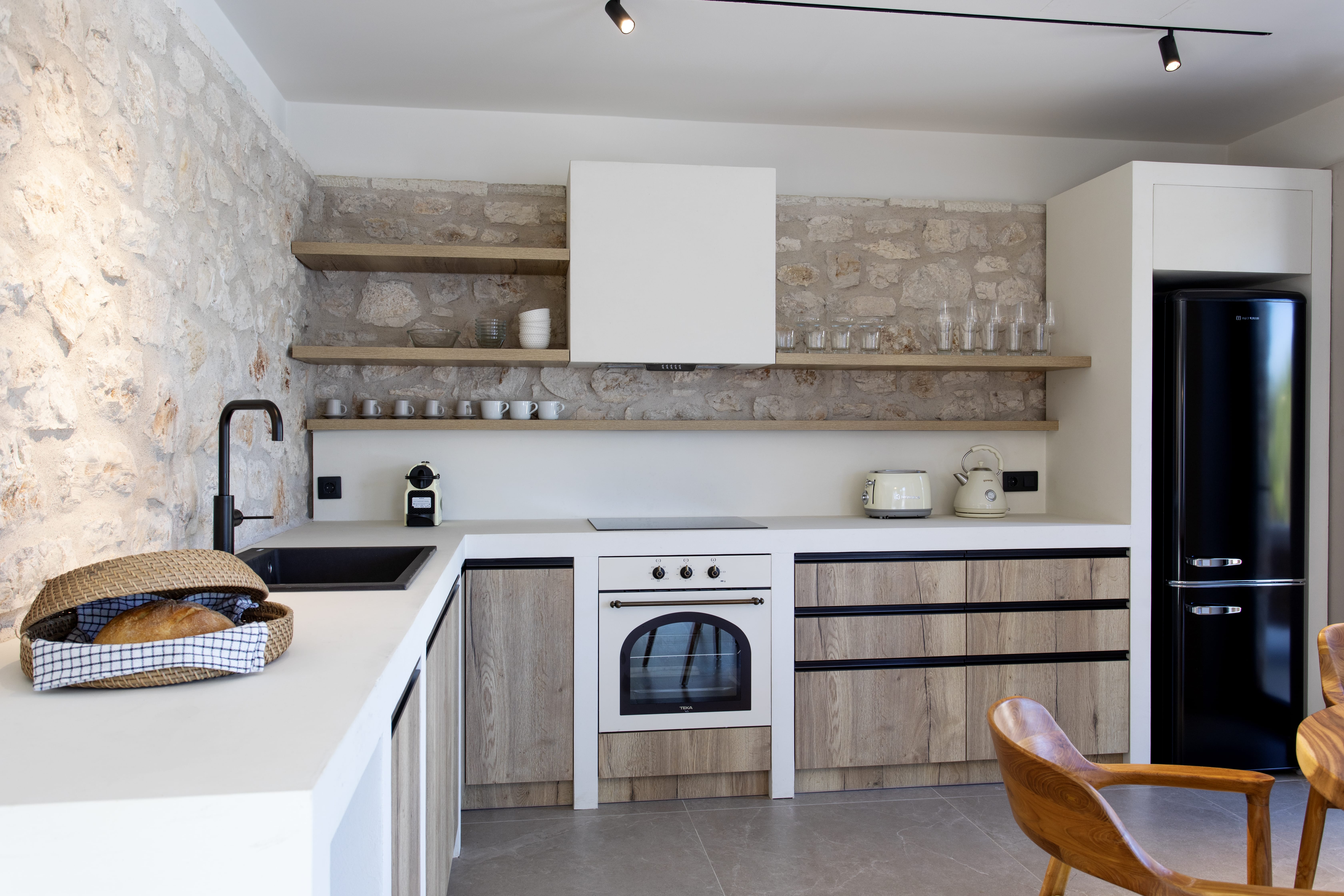 a kitchen with white cabinets