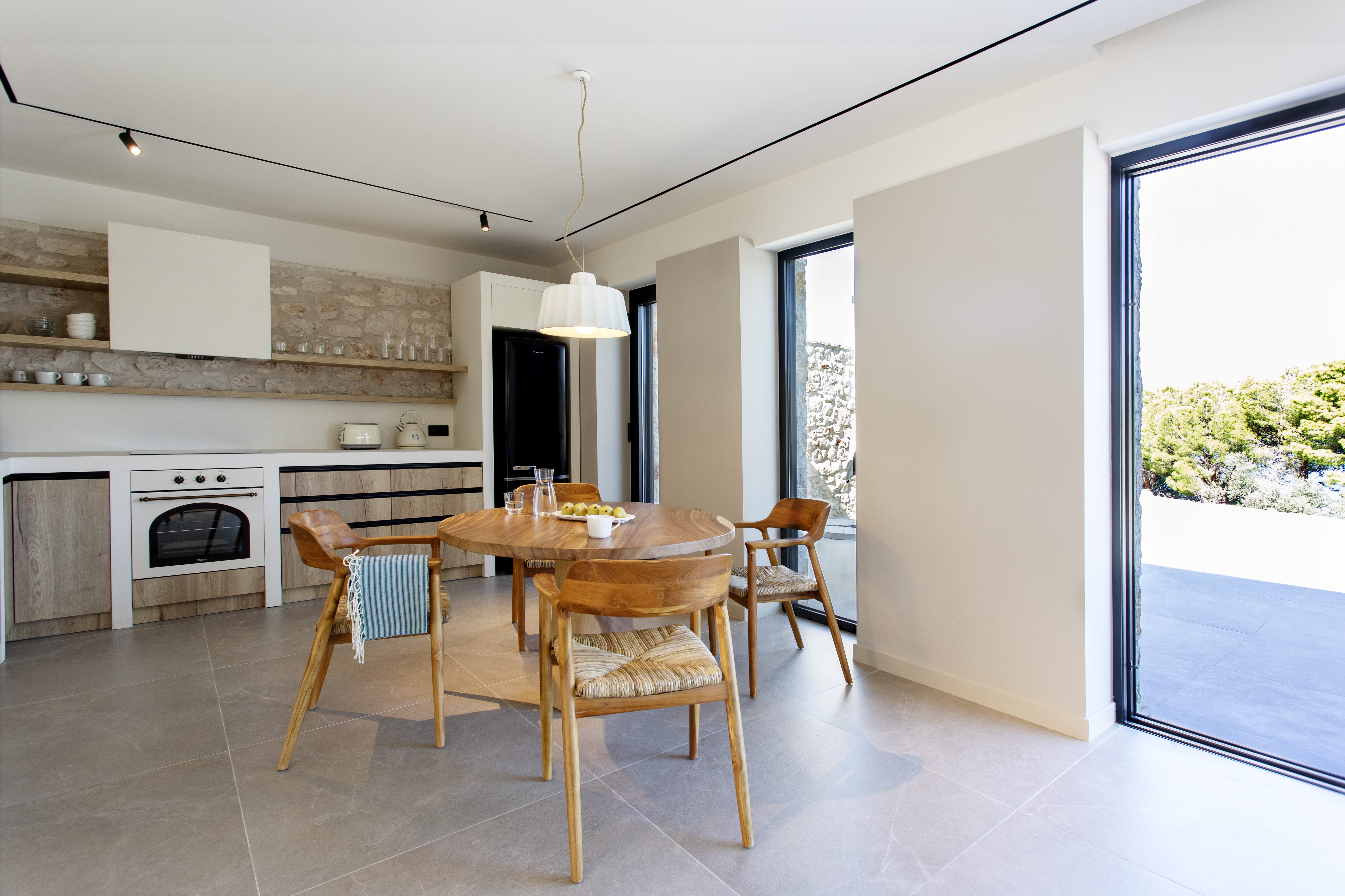 a kitchen with a dining table