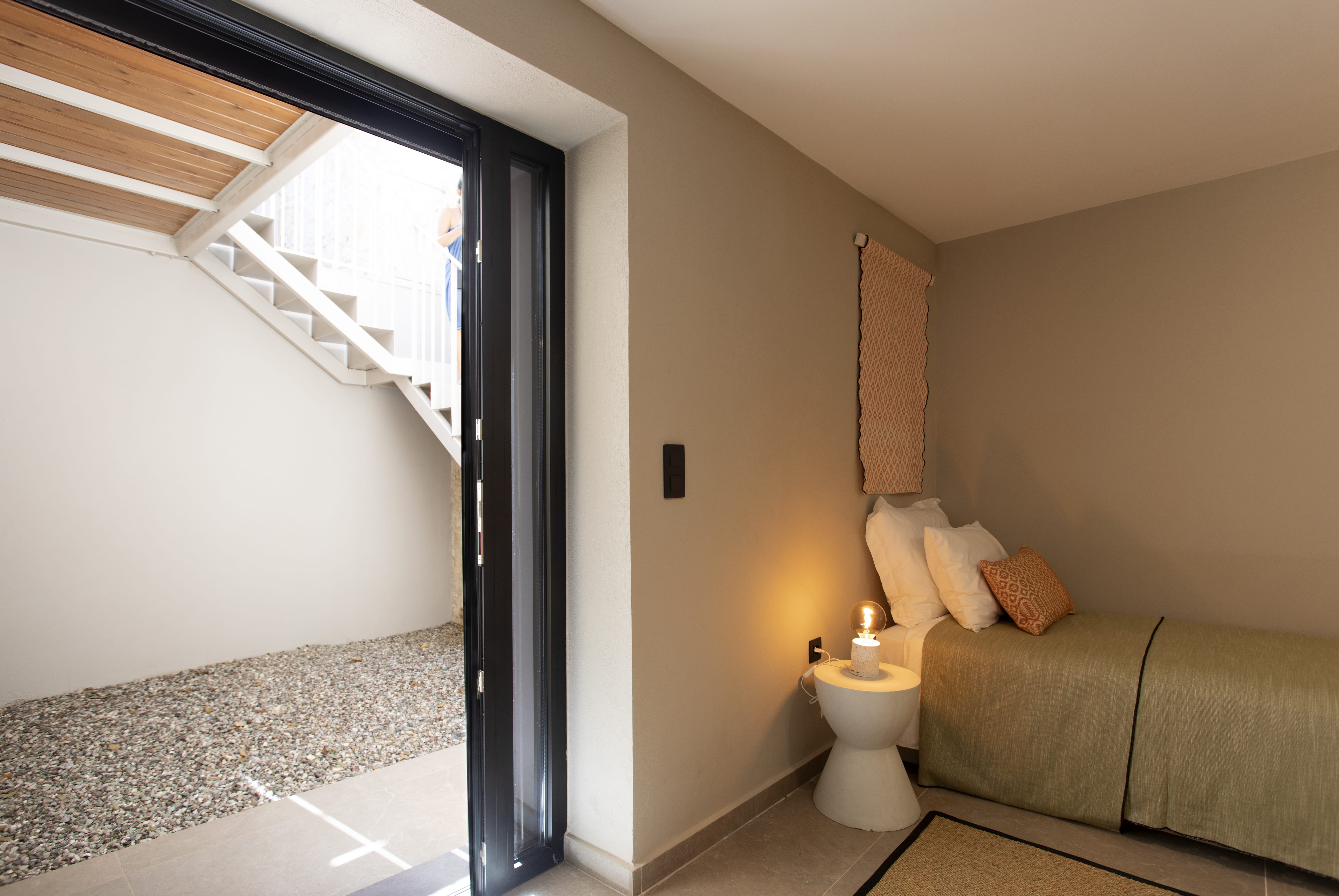 a bathroom with a couch and a toilet