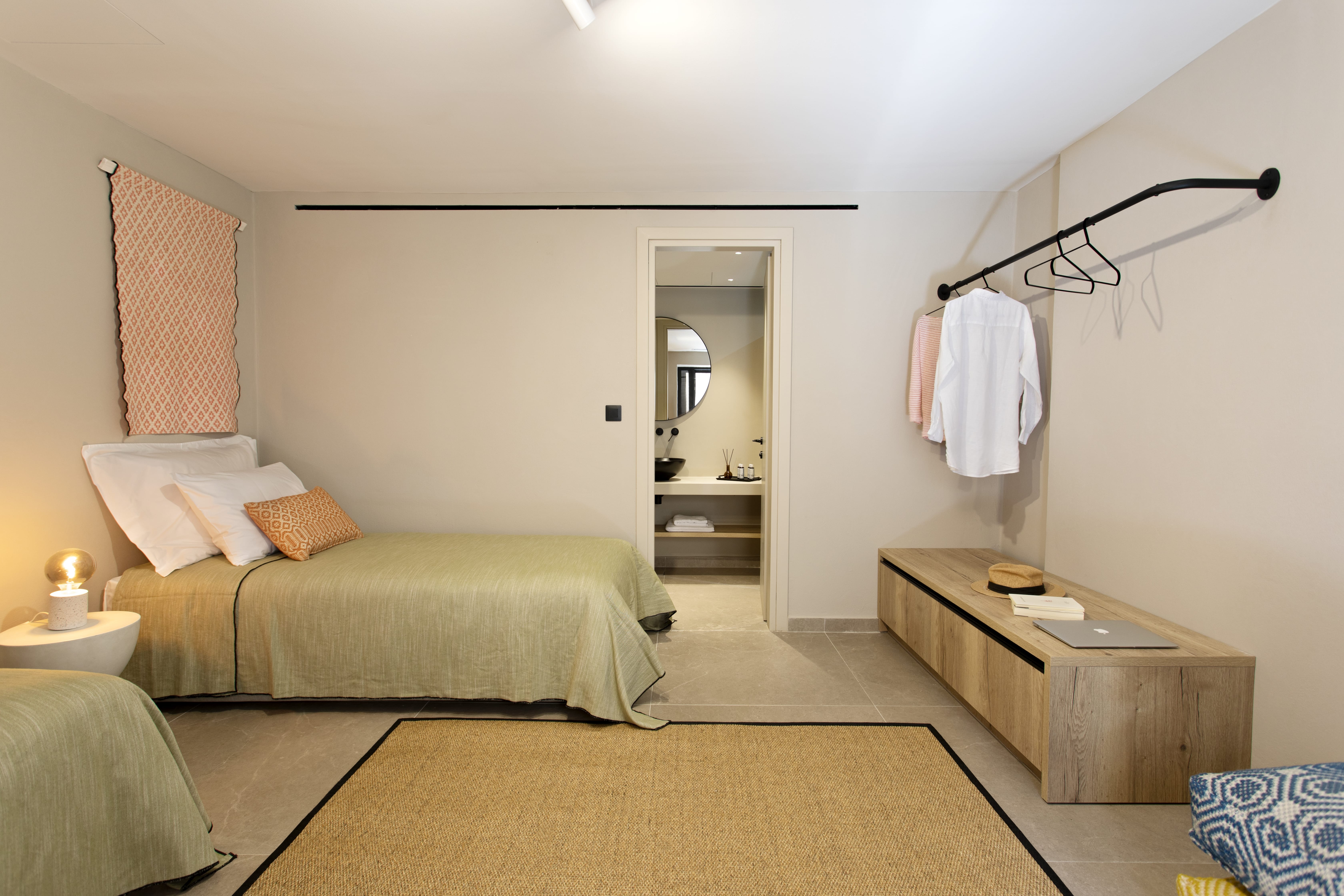 a bedroom with a bed and a mirror