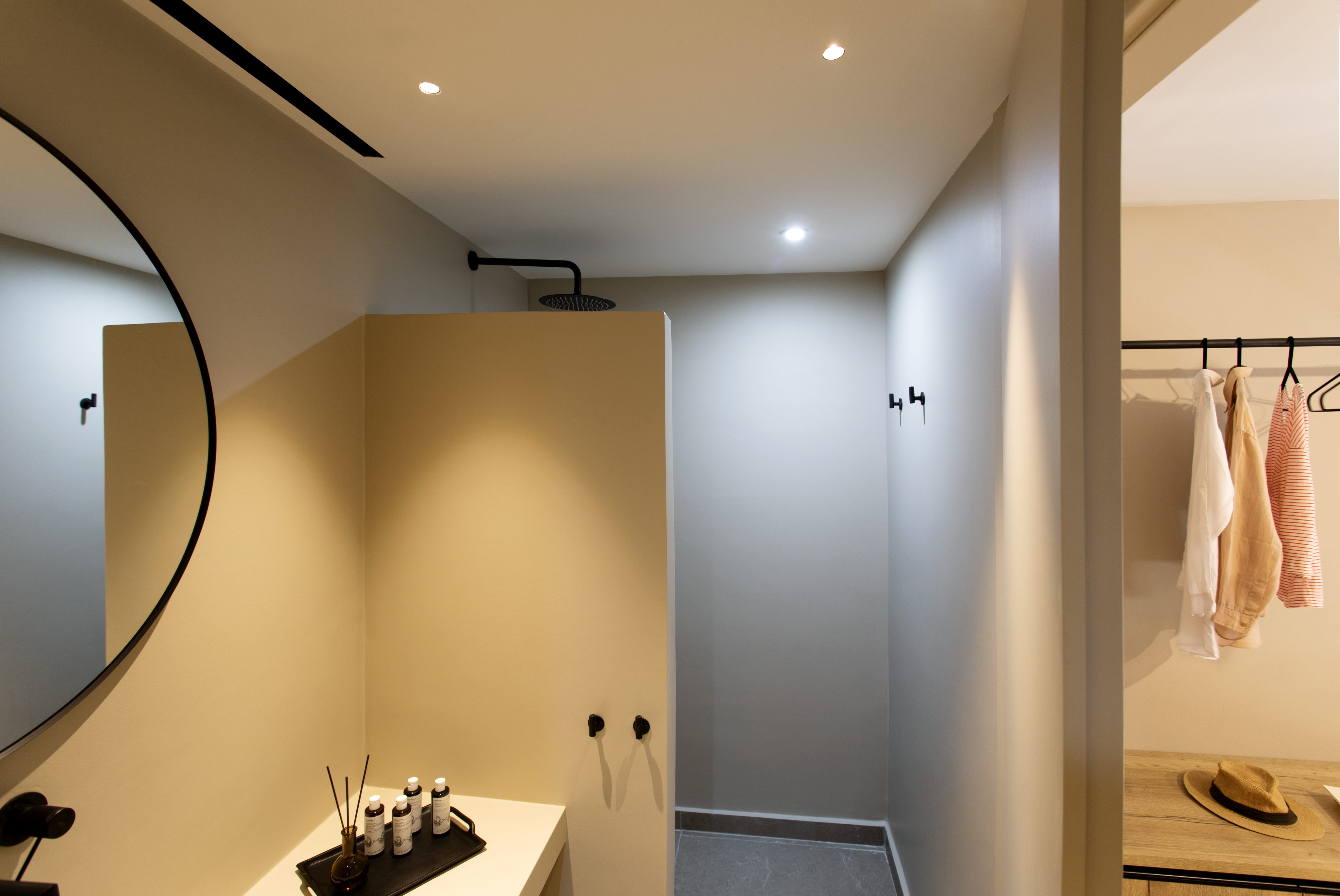 a bathroom with a mirror and a sink