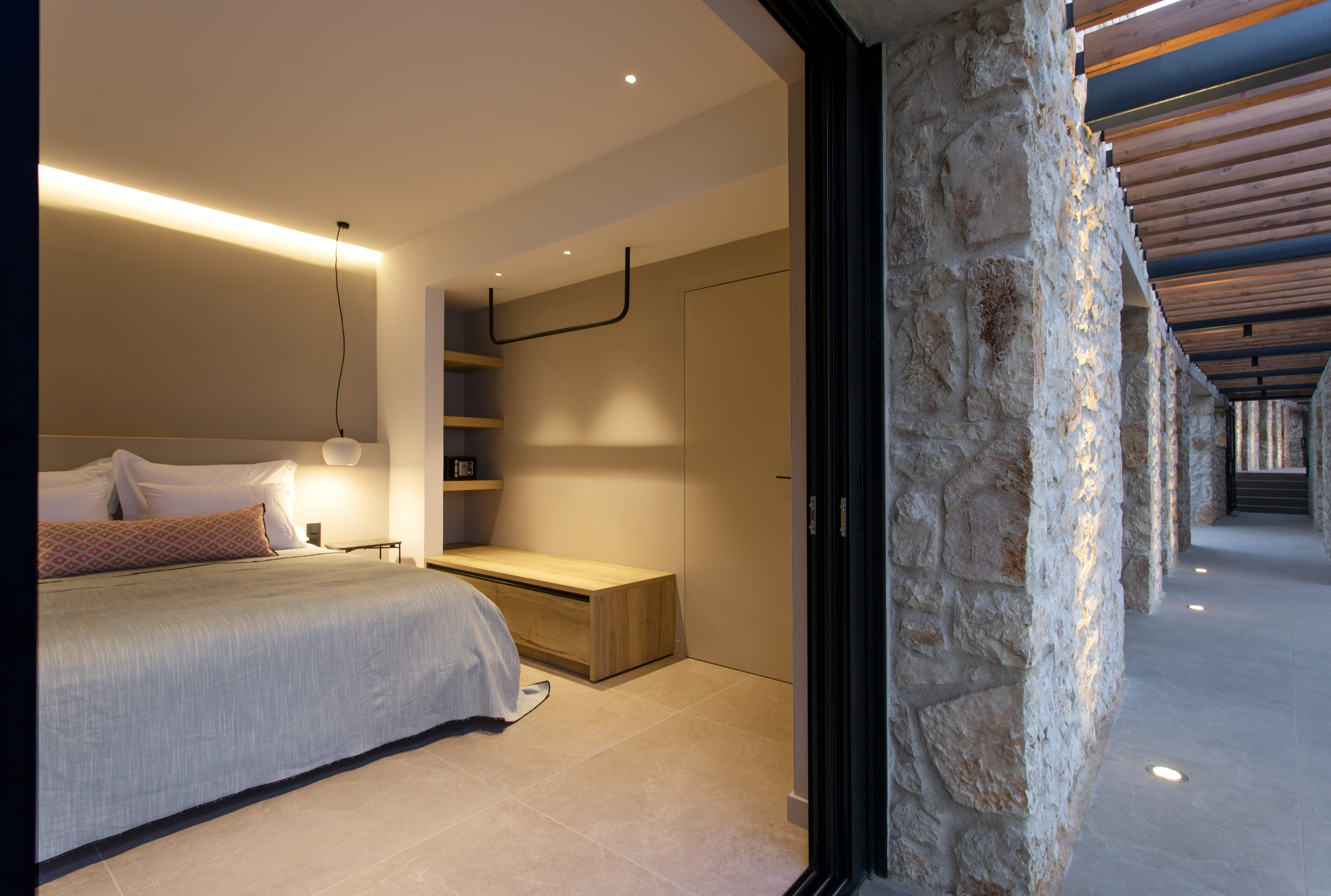 a bedroom with a bed and a desk