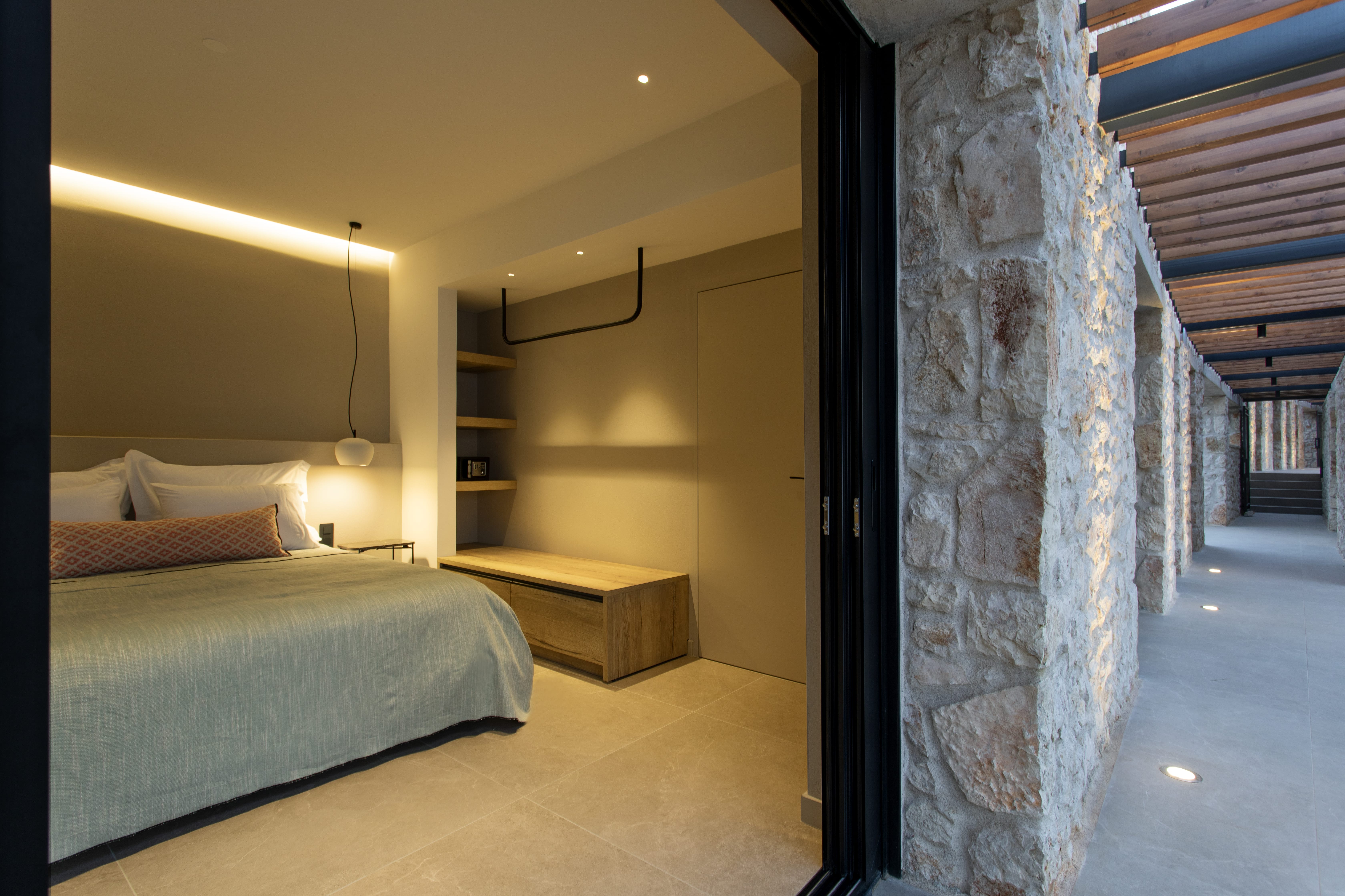 a bedroom with a bed and a desk