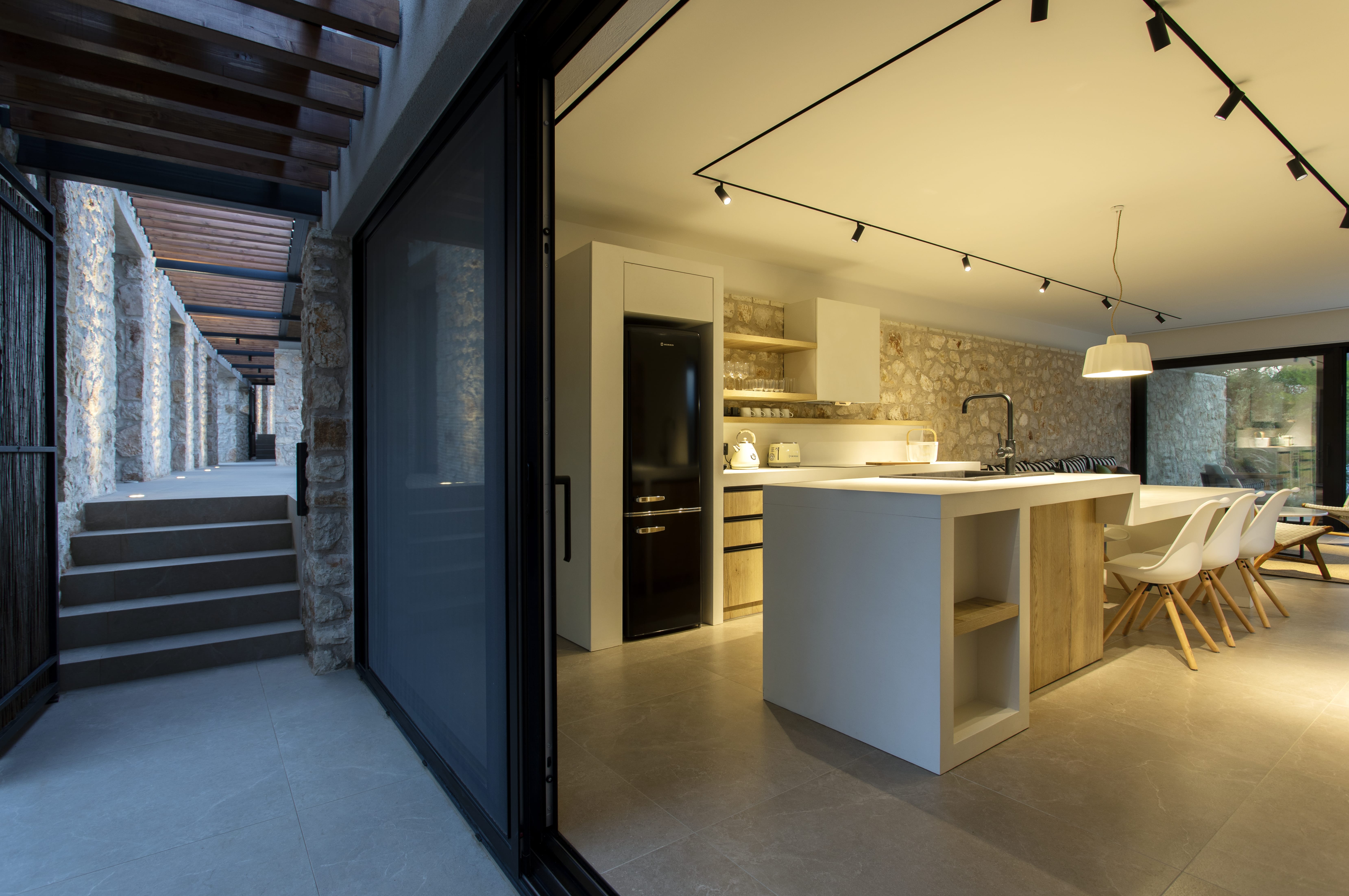 a kitchen with a large glass door