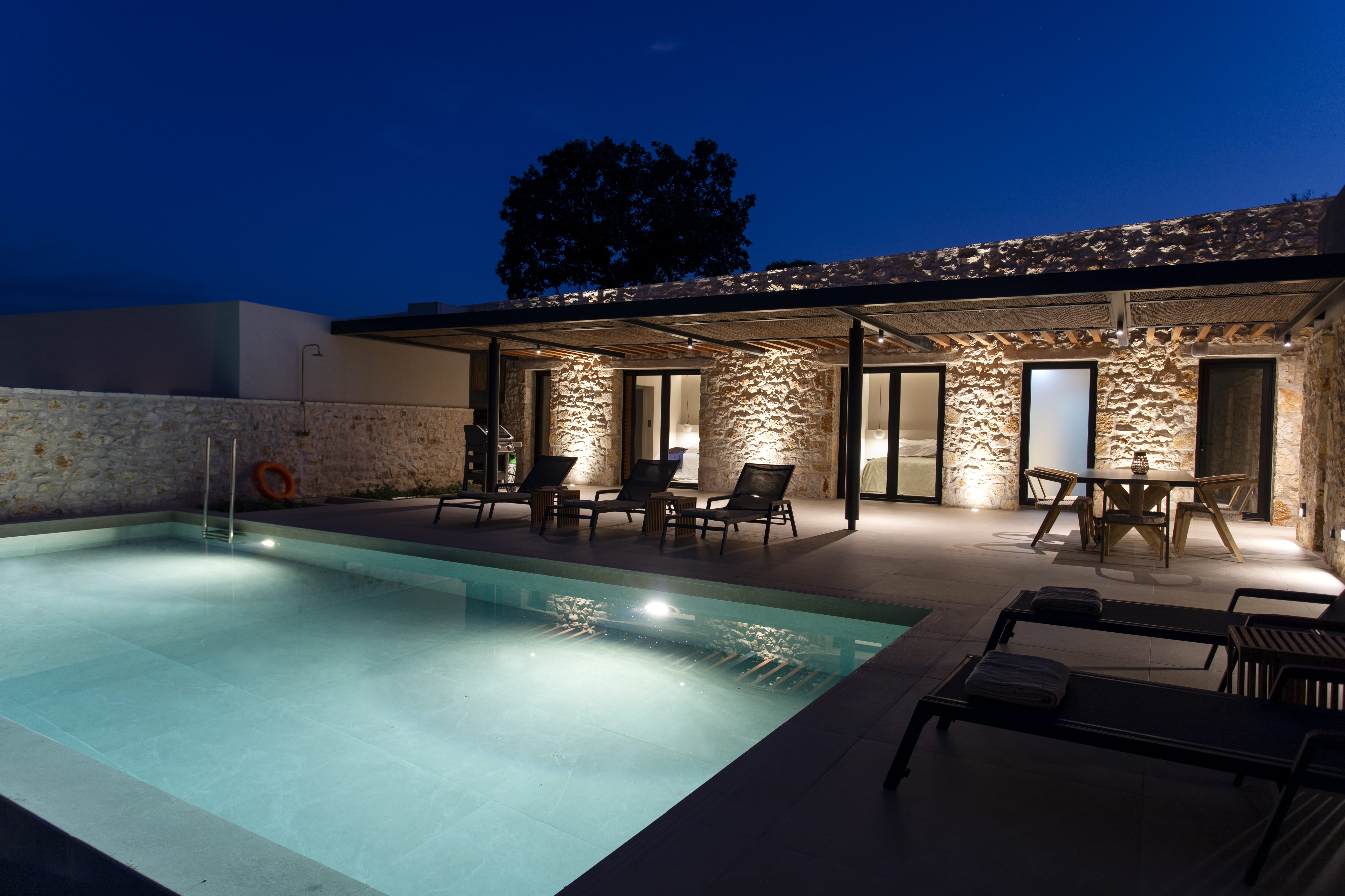 a pool with a house in the background