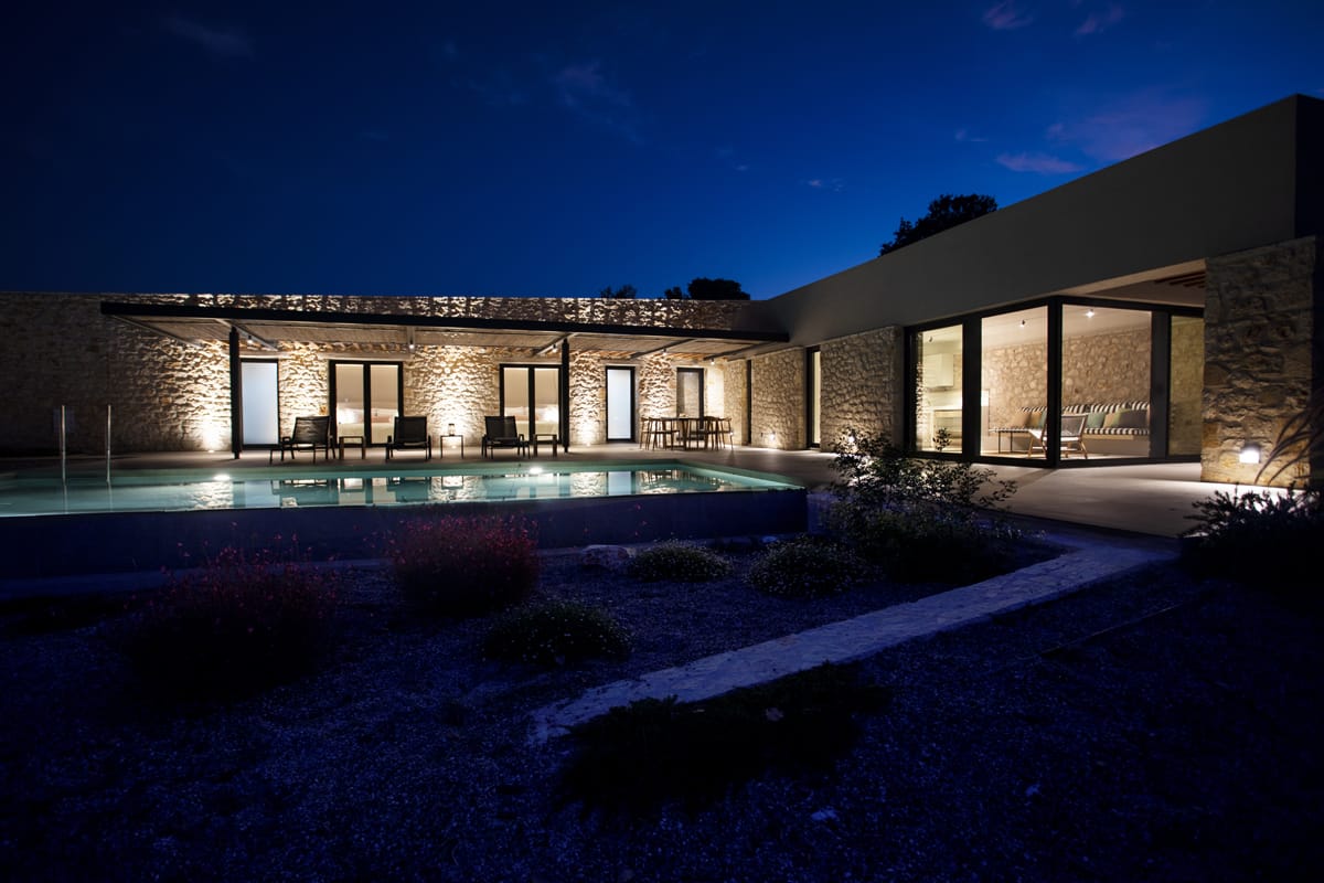 a building with a pool in front