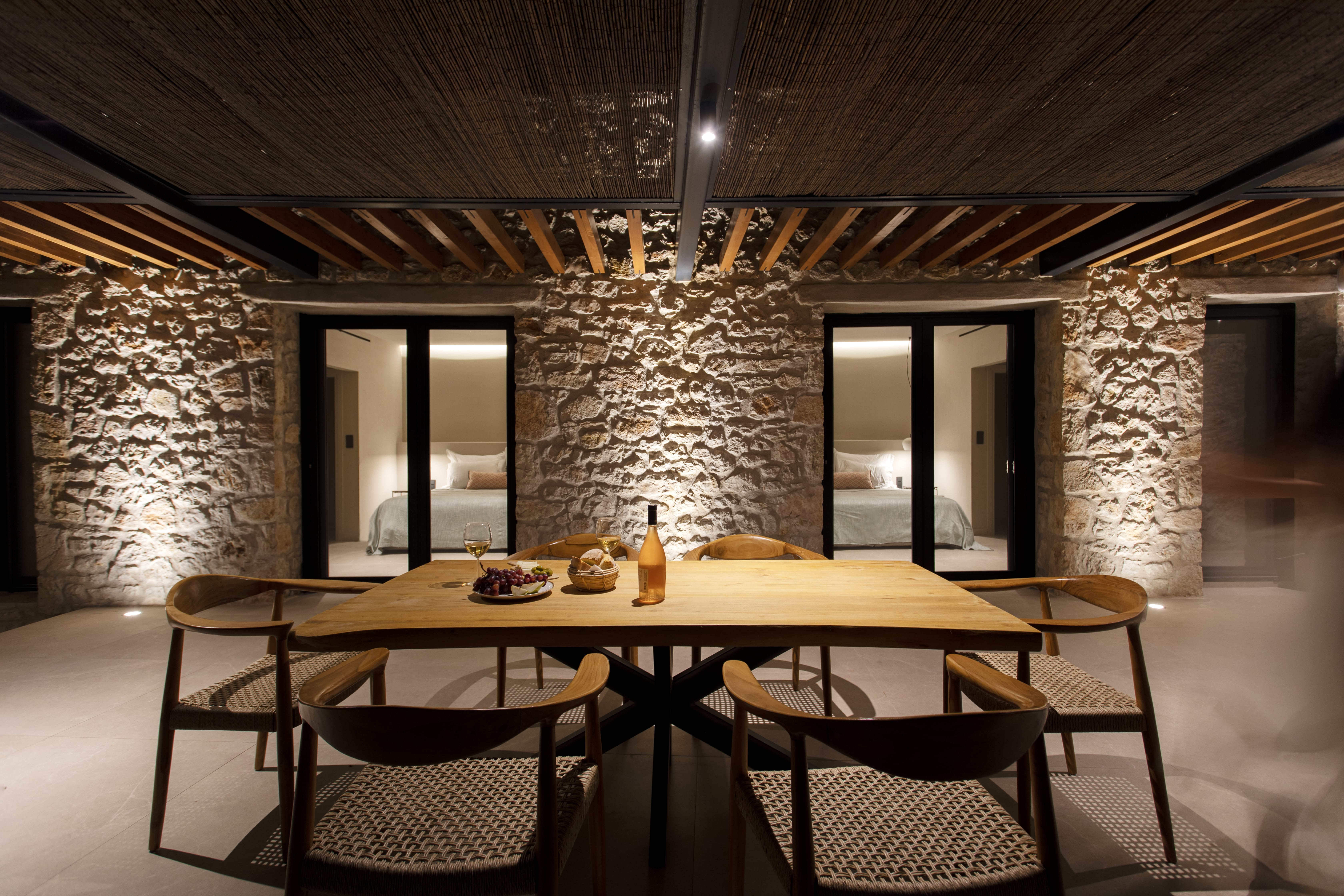 a large dining room with a stone ceiling