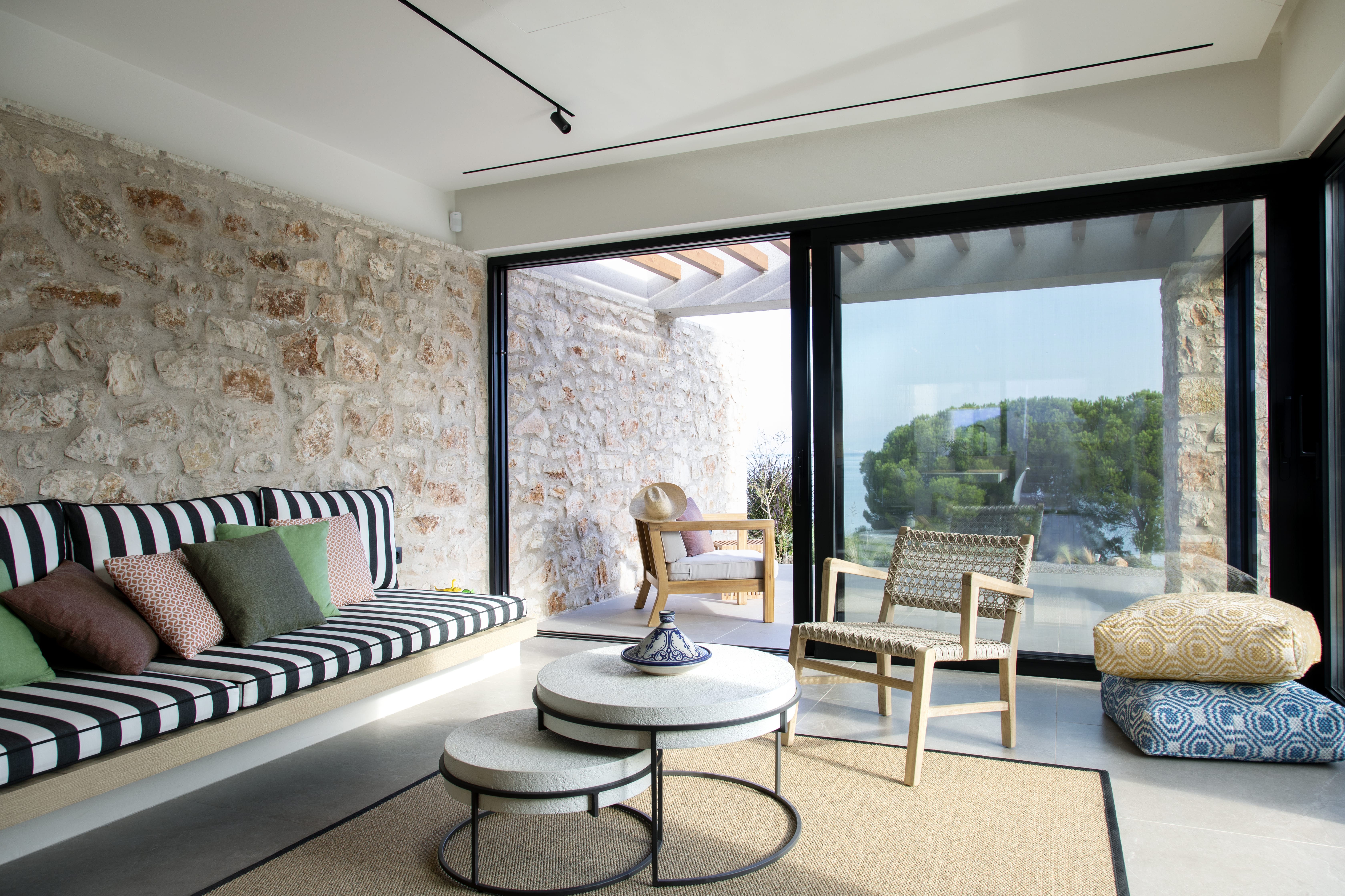 a room with a couch and chairs