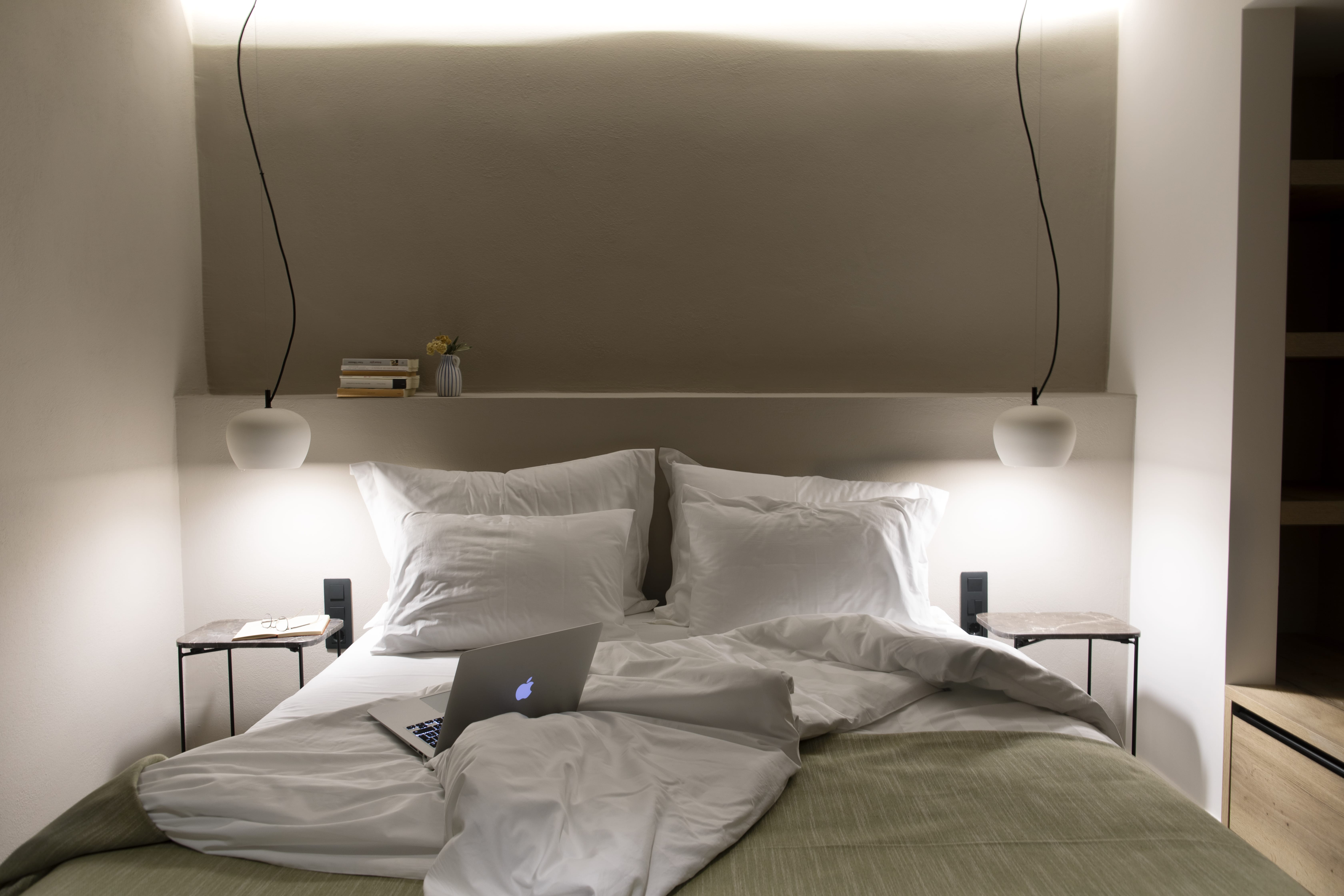 a bed with a lamp on it