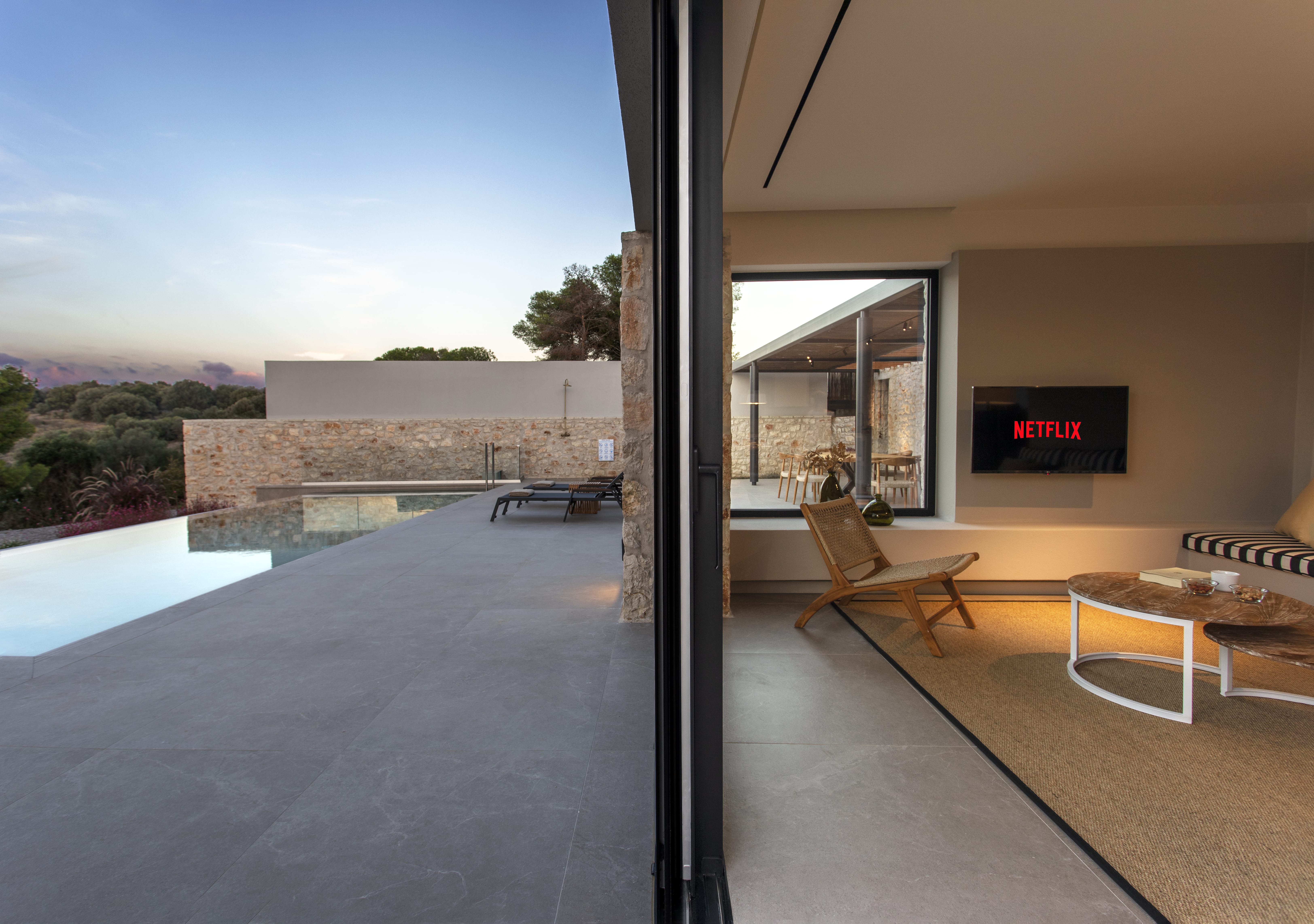 a room with a pool and a tv