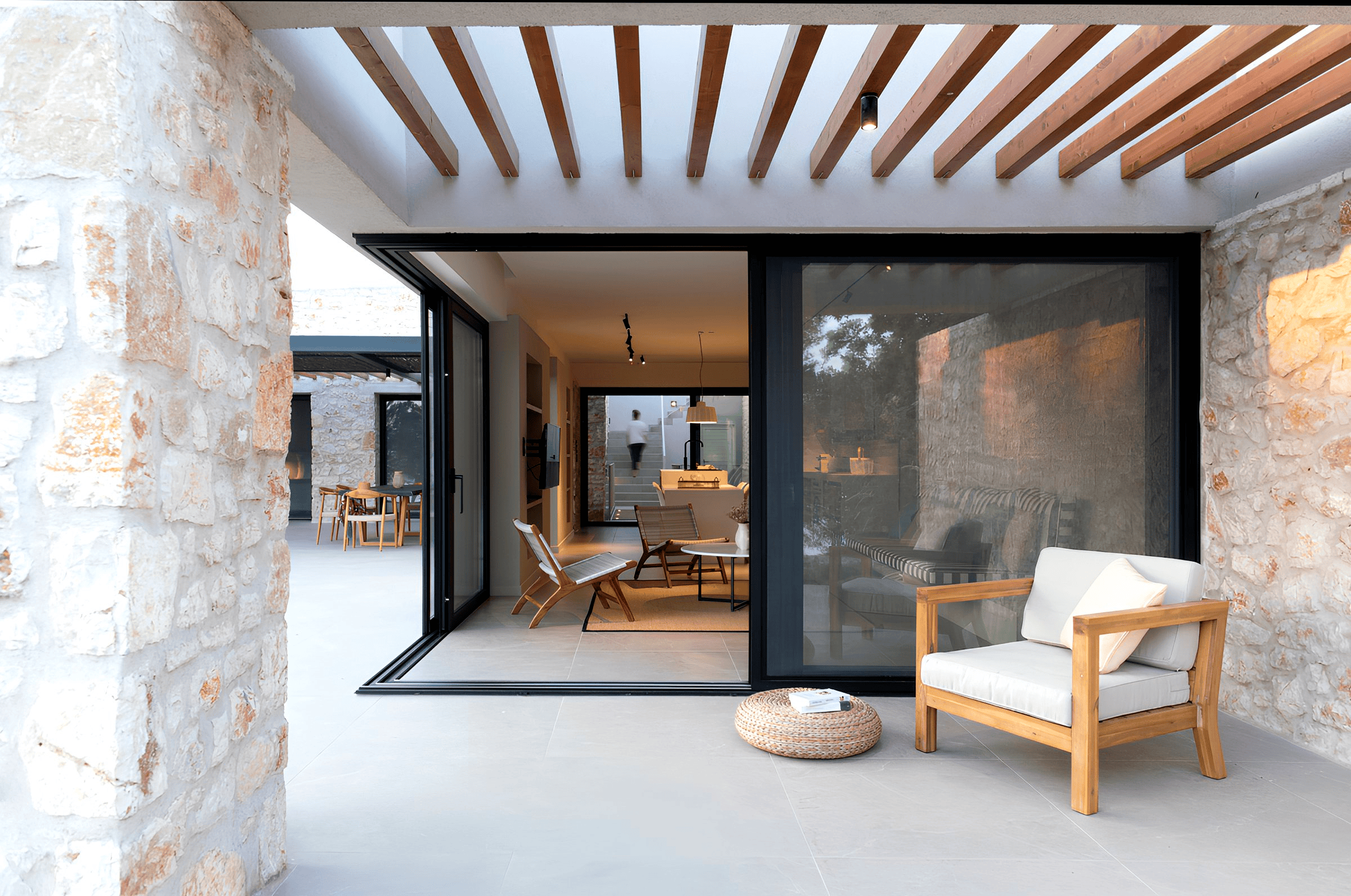 a room with a fireplace and chairs