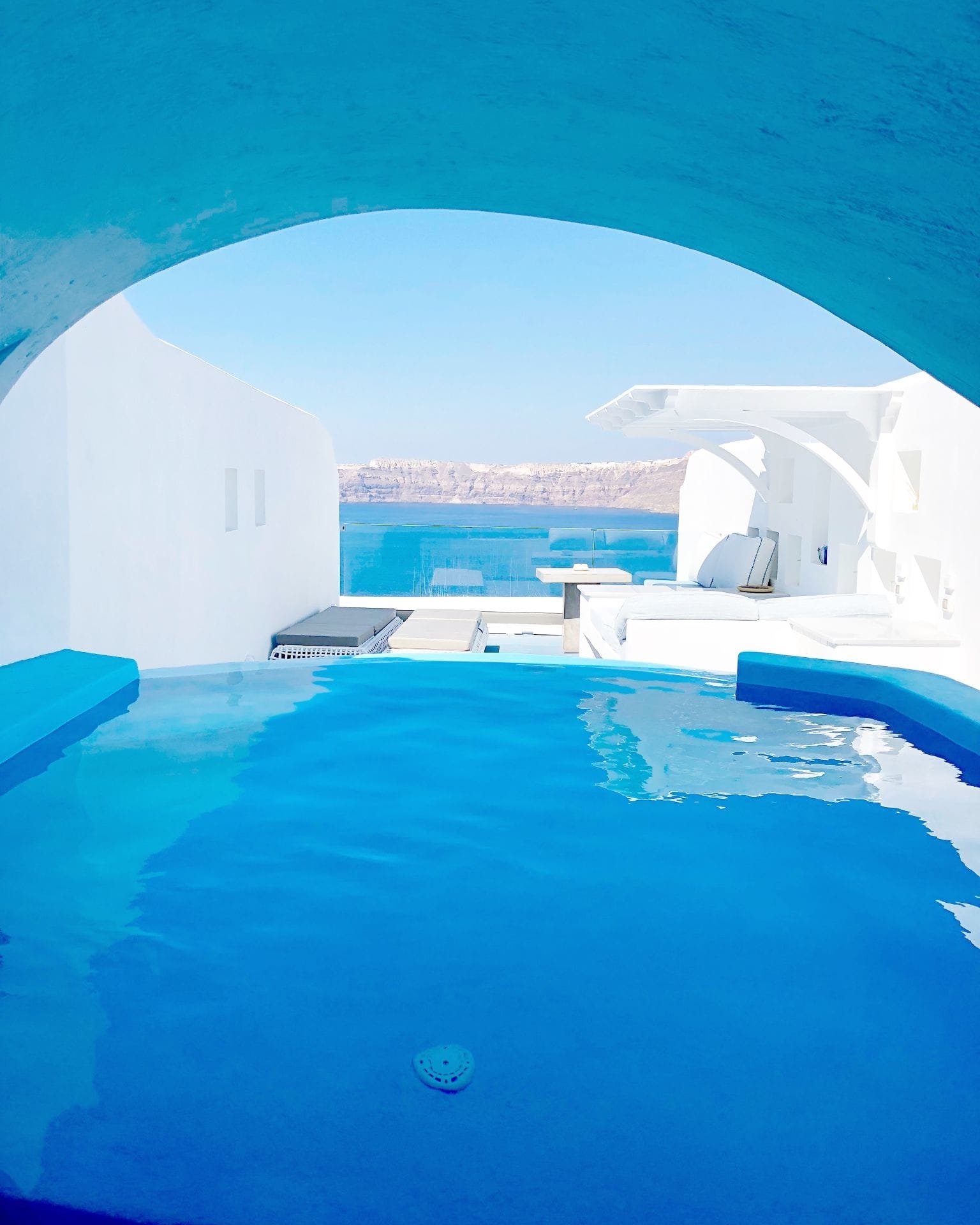 a pool with a building in the background