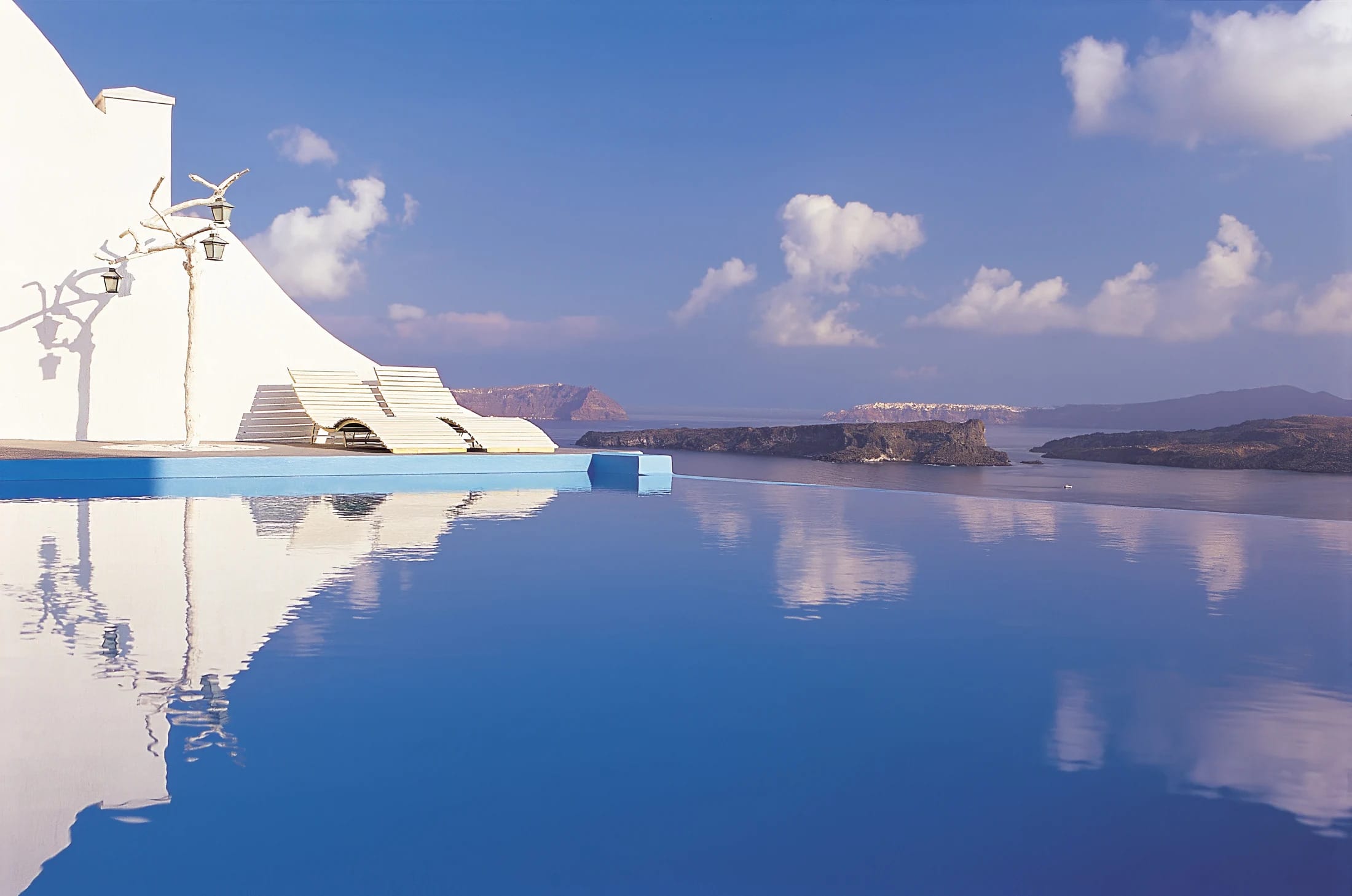 a reflection of a bridge in water