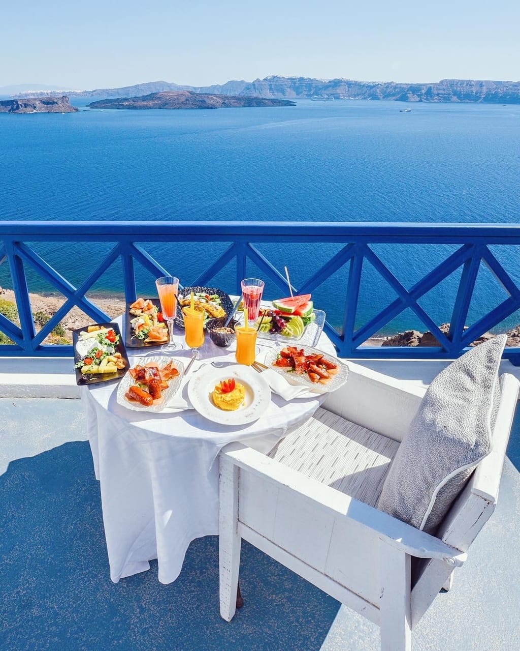 a table with food on it by the water