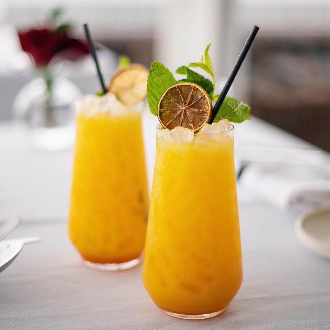 a couple of glass cups with fruit in them