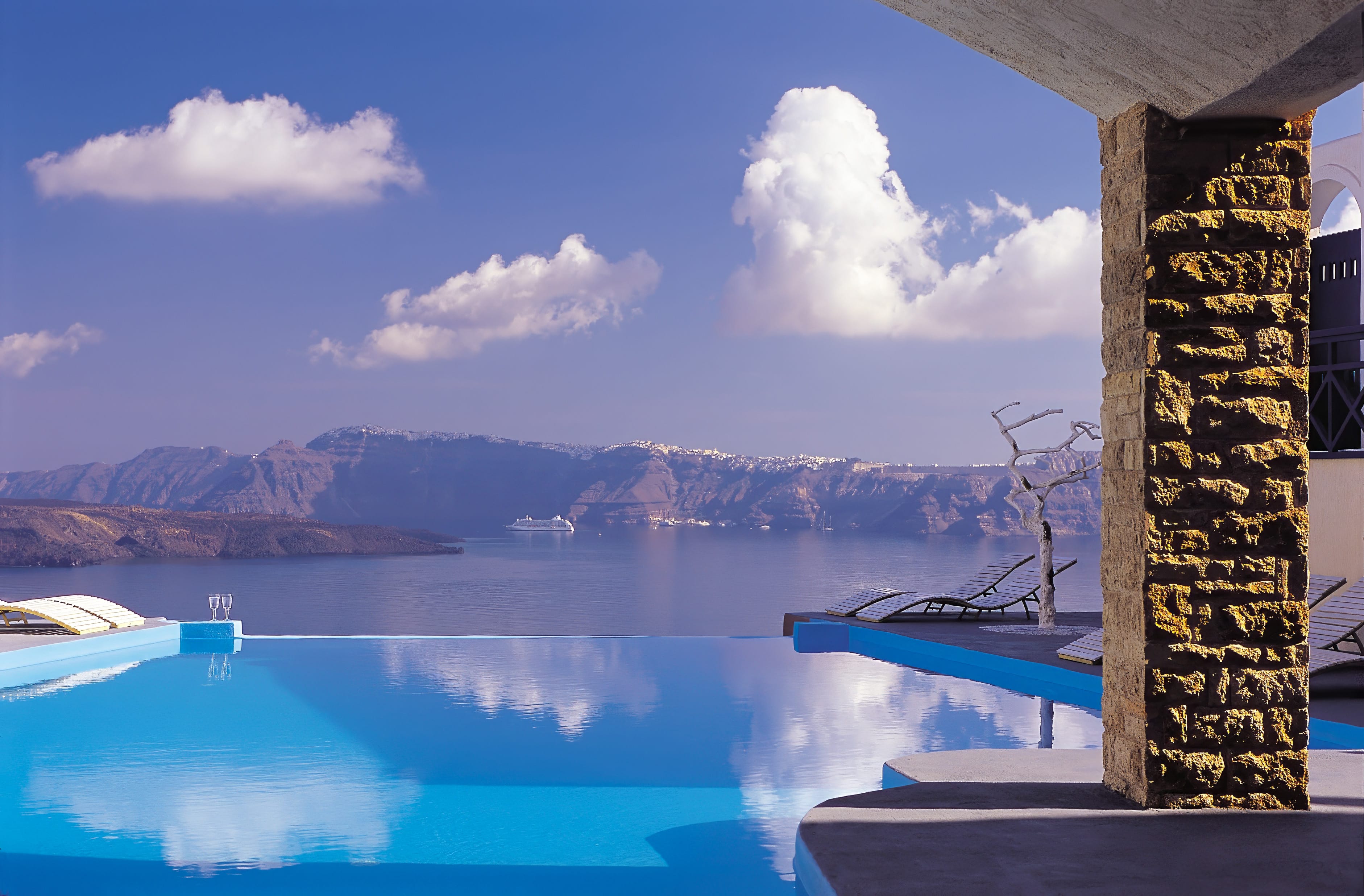 a tall tower with a body of water in the background