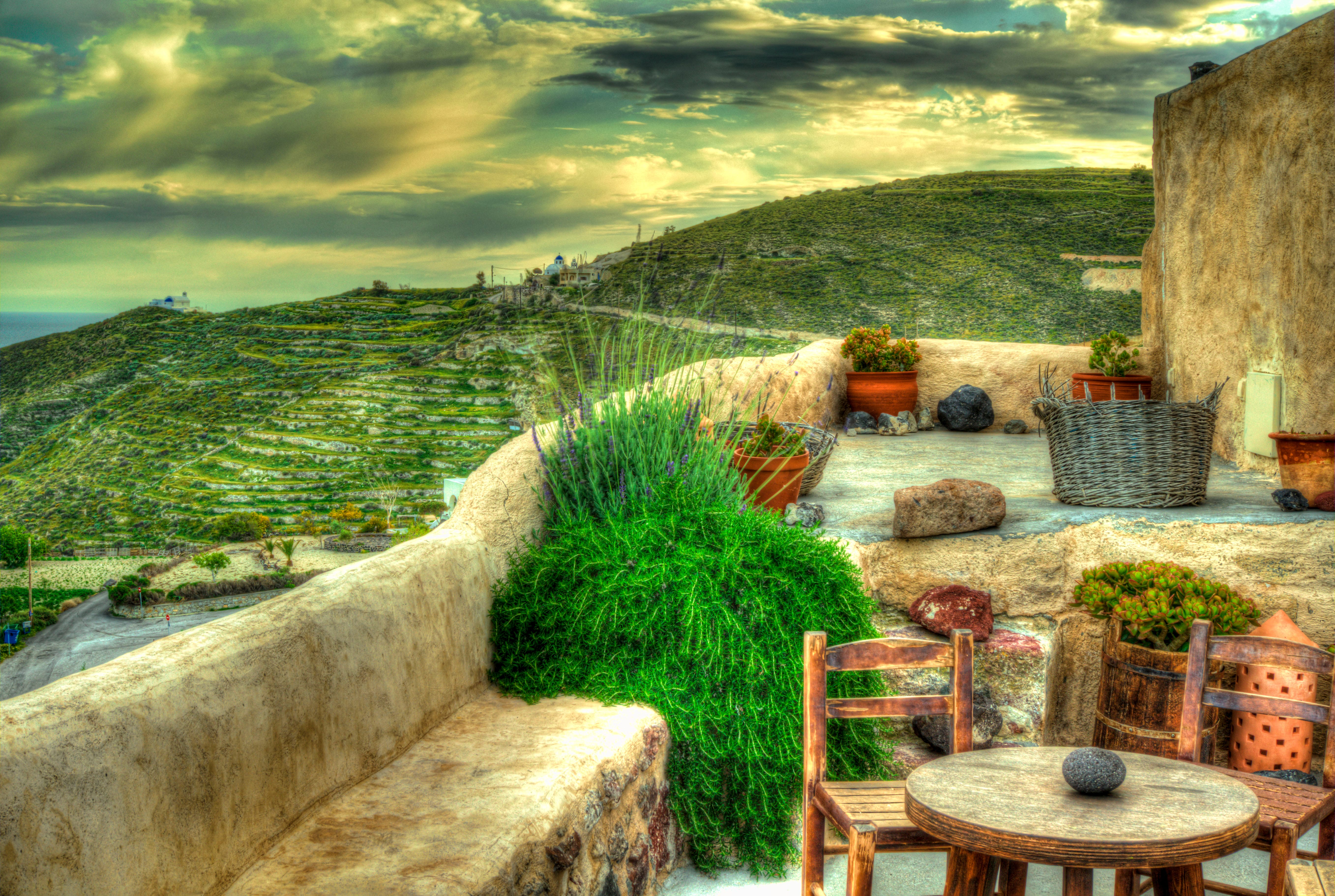 a patio with a table and chairs