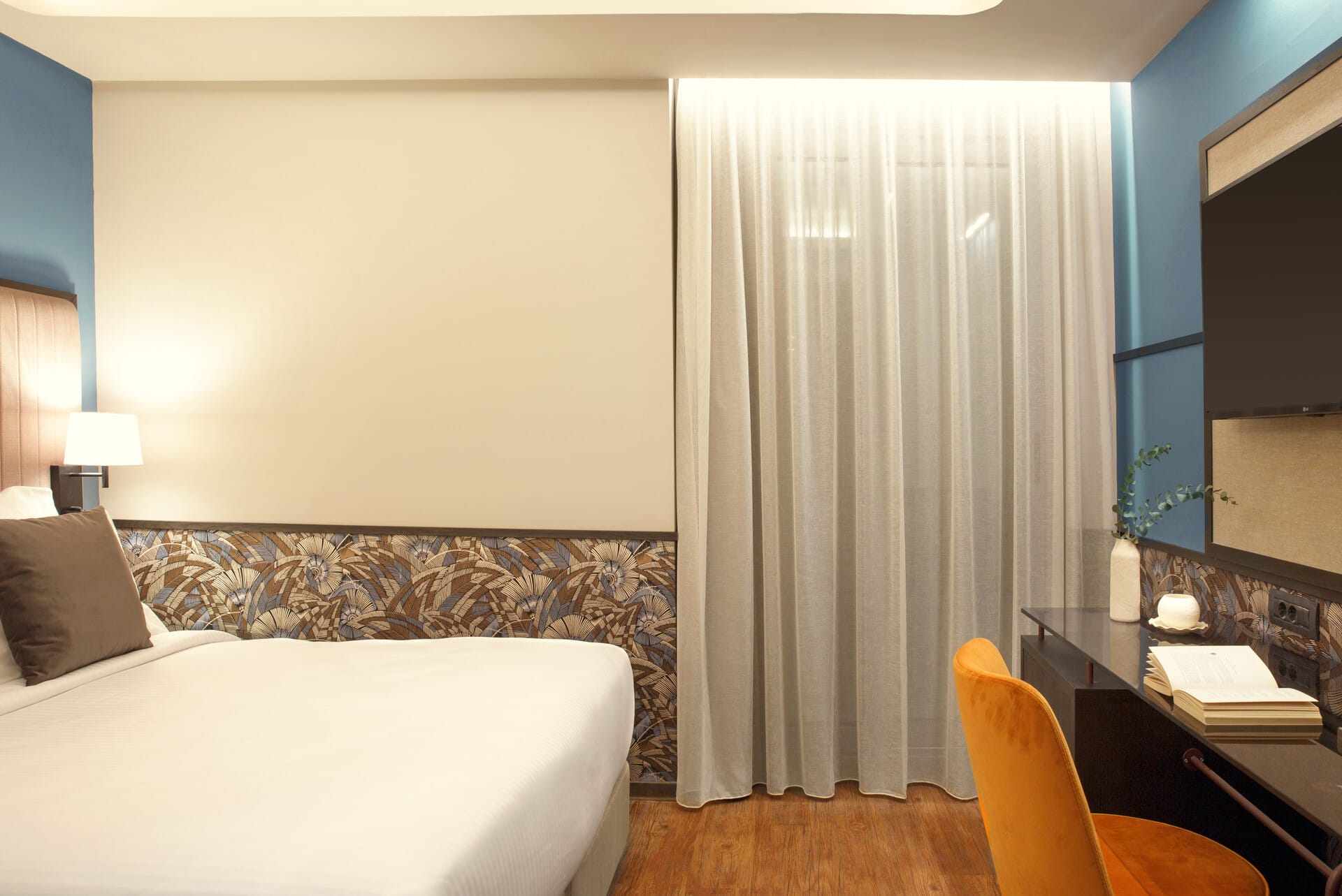 a room with a bed and a desk