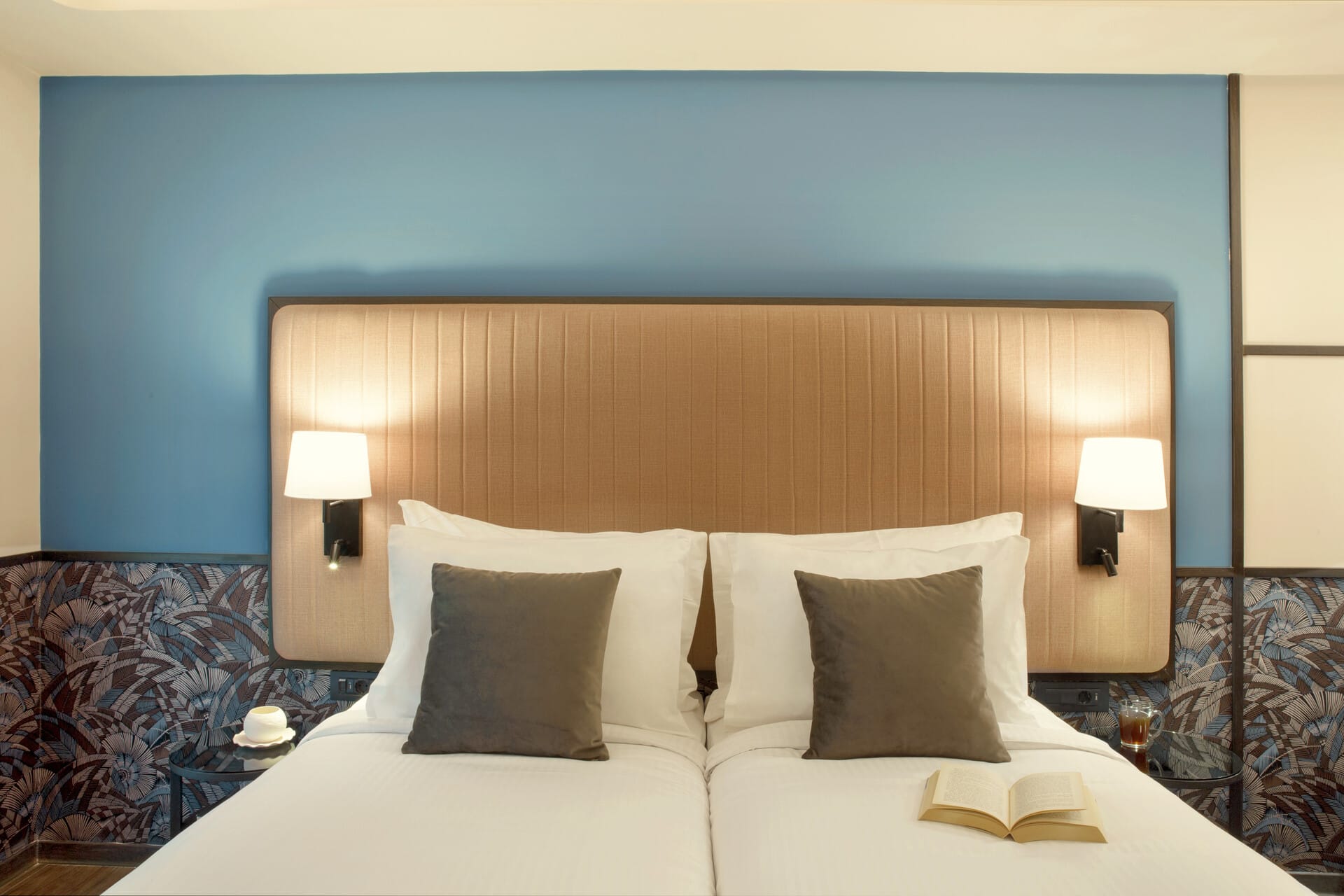 a hotel room with two beds