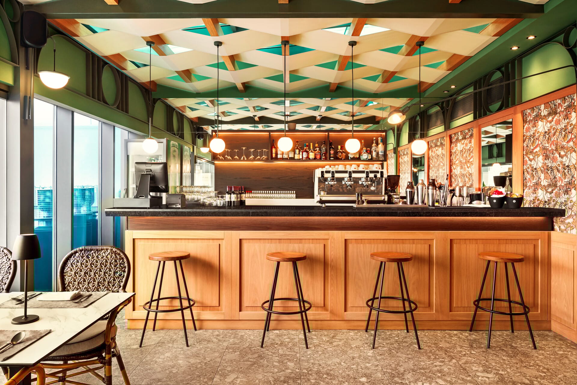 a bar with stools and a bar