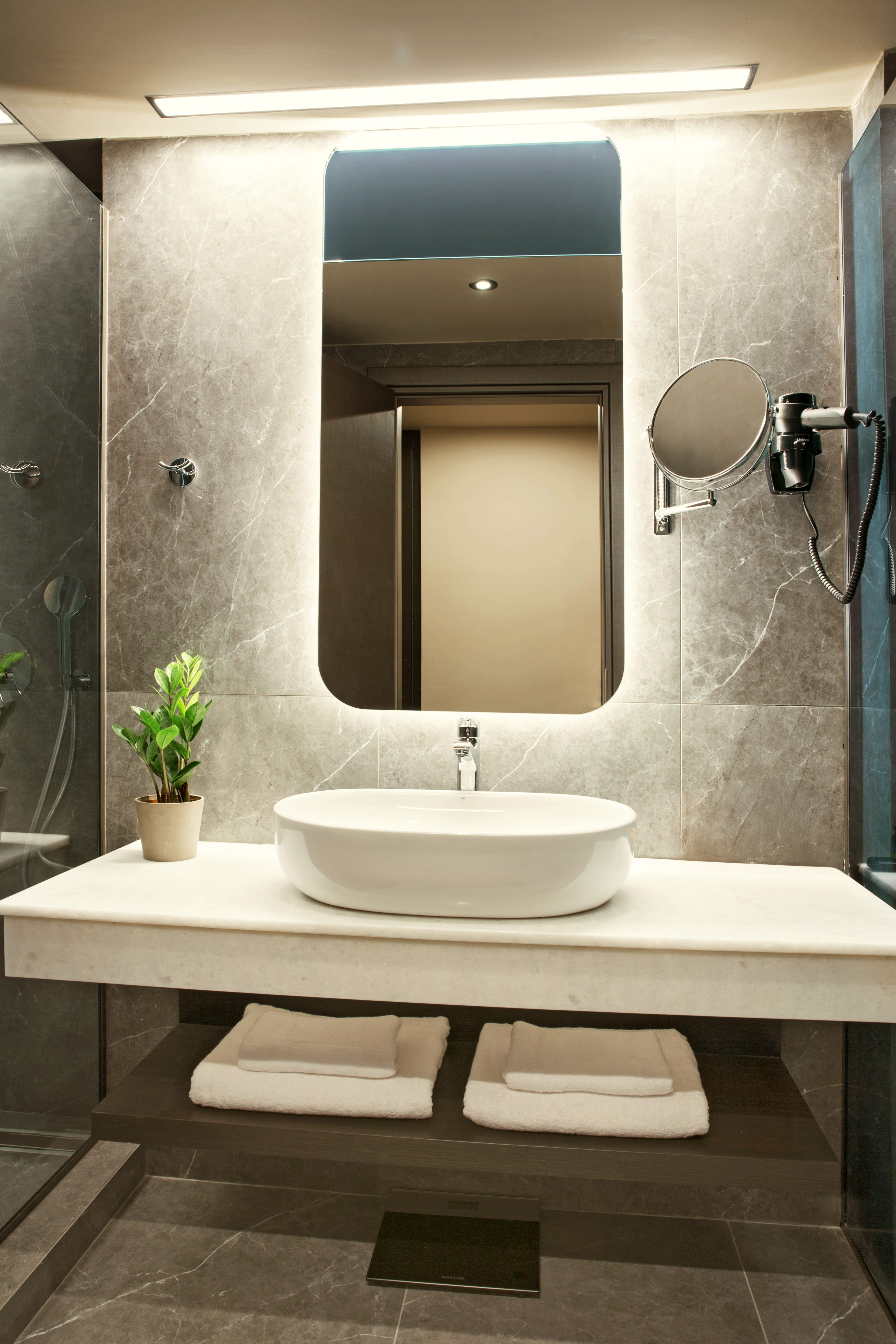 a bathroom with a large mirror