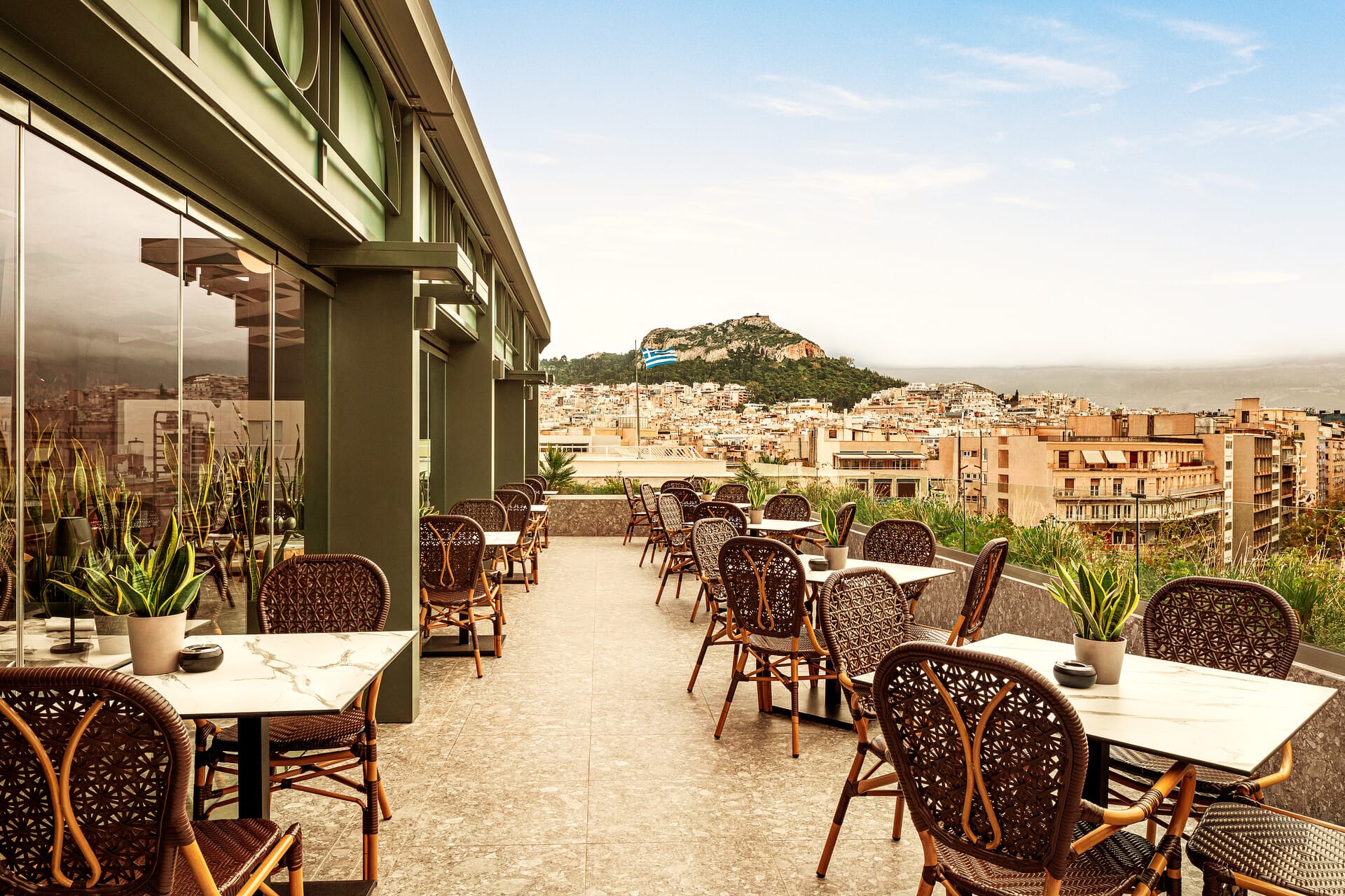 a patio with tables and chairs